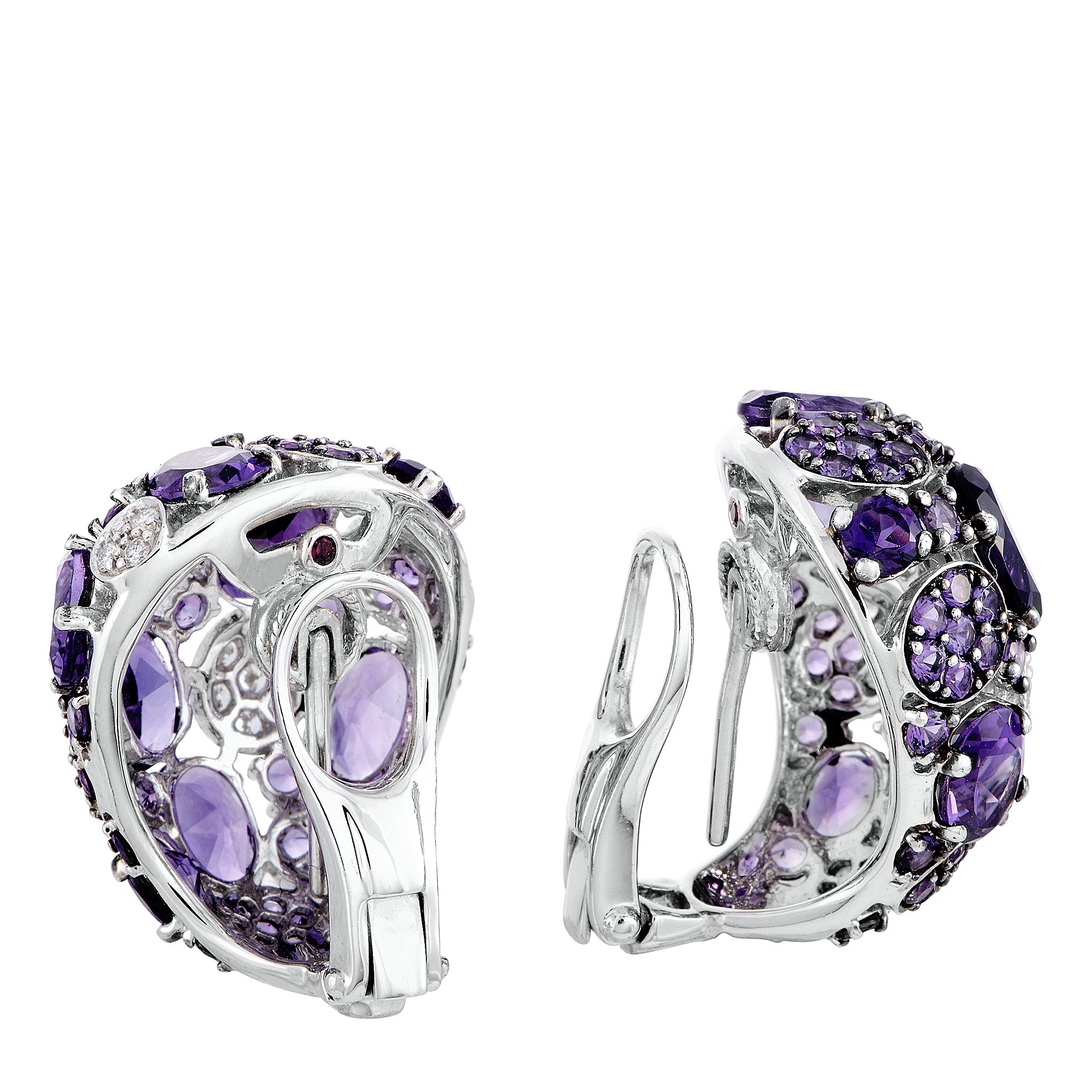 The Roberto Coin “Shanghai” earrings are crafted from 18K white gold and each weighs 10 grams, measuring 0.90” in length and 0.75” in width. The earrings are embellished with amethysts and a total of 0.36 carats of diamonds.

The pair is offered in