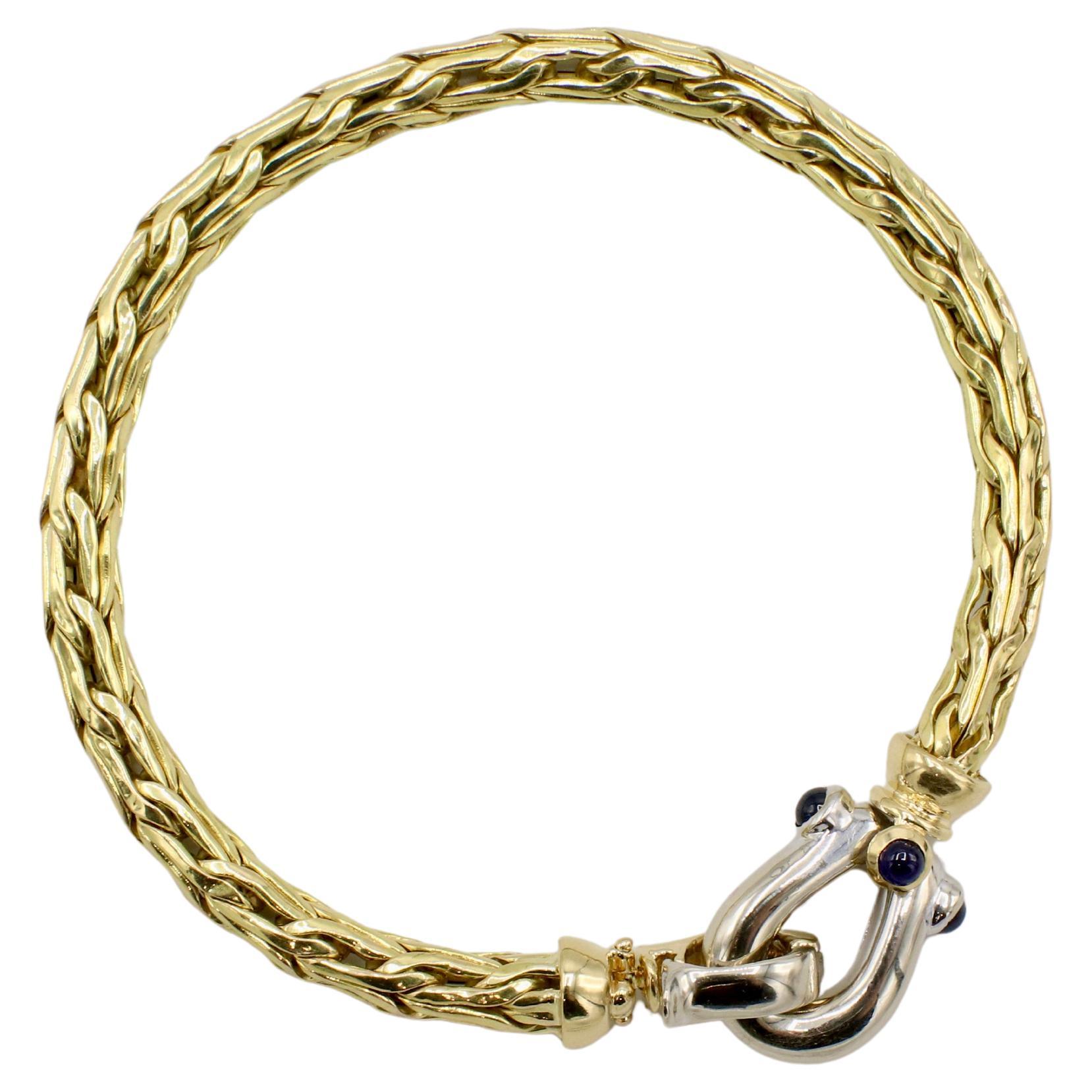 Roberto Coin Spiga 18 Karat Yellow Gold Woven Link Blue Sapphire Buckle Bracelet
Metal: 18k yellow/white gold
Weight: 15.11 grams
Width: 5mm
Size: Fits a 6.75 inch wrist (clasped) 
