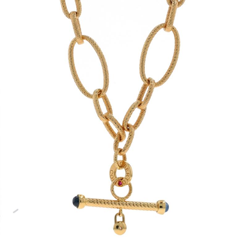 Retail Price: $14,500 (estimated)

Brand: Roberto Coin
Design: Textured Oval Toggle

Metal Content: 18k Yellow Gold

Stone Information
Natural Sapphires
Treatment: Heating
Cut: Round Cabochon
Color: Blue

Natural Diamond
Cut: Round
Stone Note: