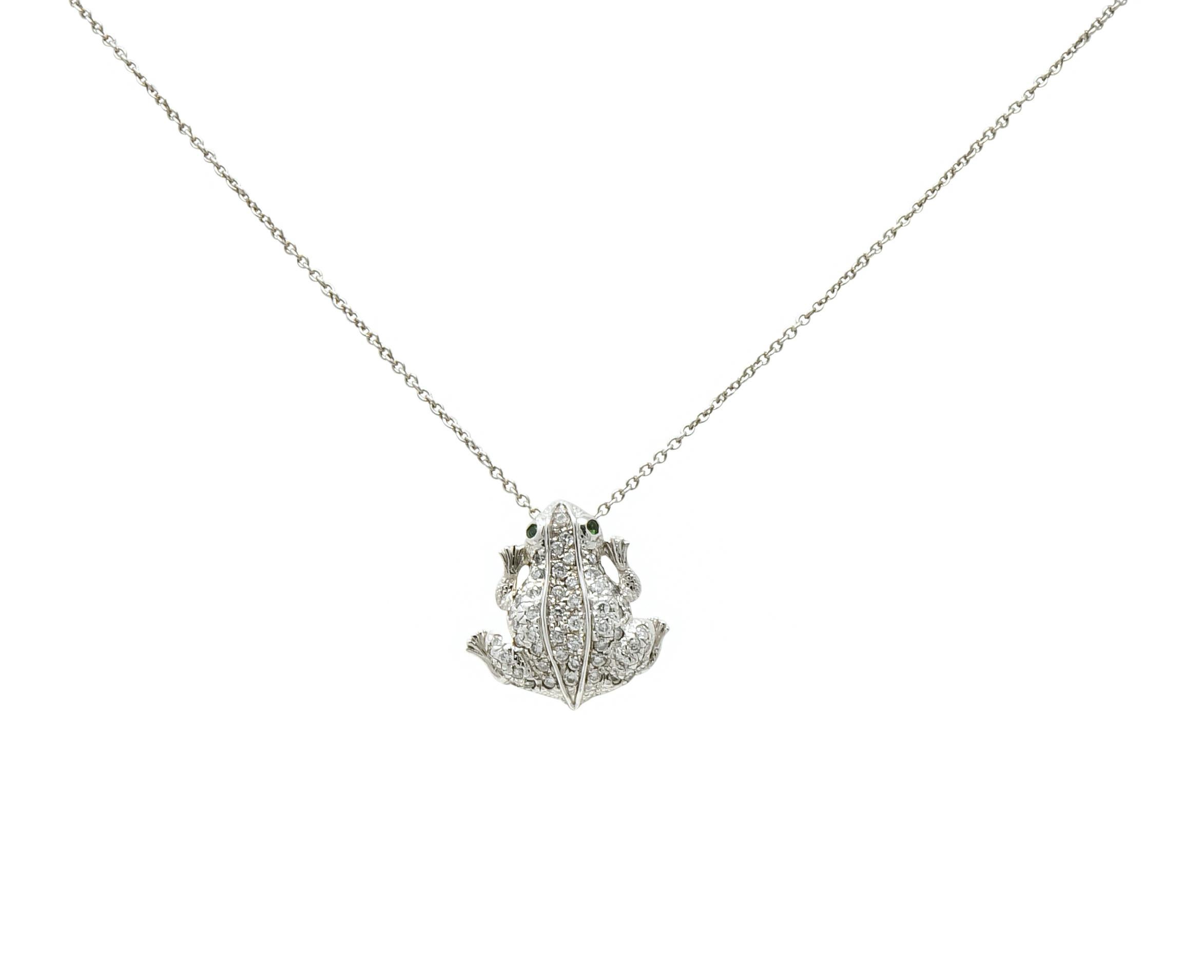 Necklace designed as frog set throughout with round brilliant cut diamonds weighing approximately 0.35 carat total, eye clean and white

Accented by bezel set vibrant emerald eyes

From the Tiny Treasures collection

Accompanied by 18 karat white