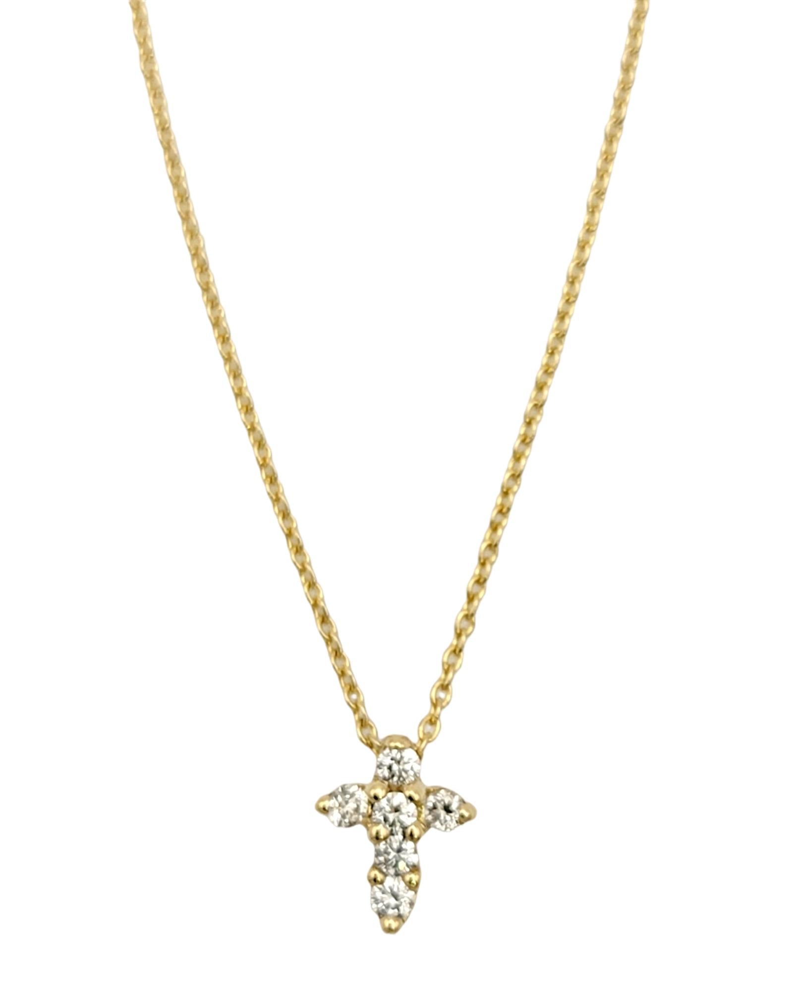 You will love this delicate pave diamond tiny cross necklace by Roberto Coin. Simple and classic, this versatile piece adds a little extra sparkle to any look. This necklace can be worn at the 18