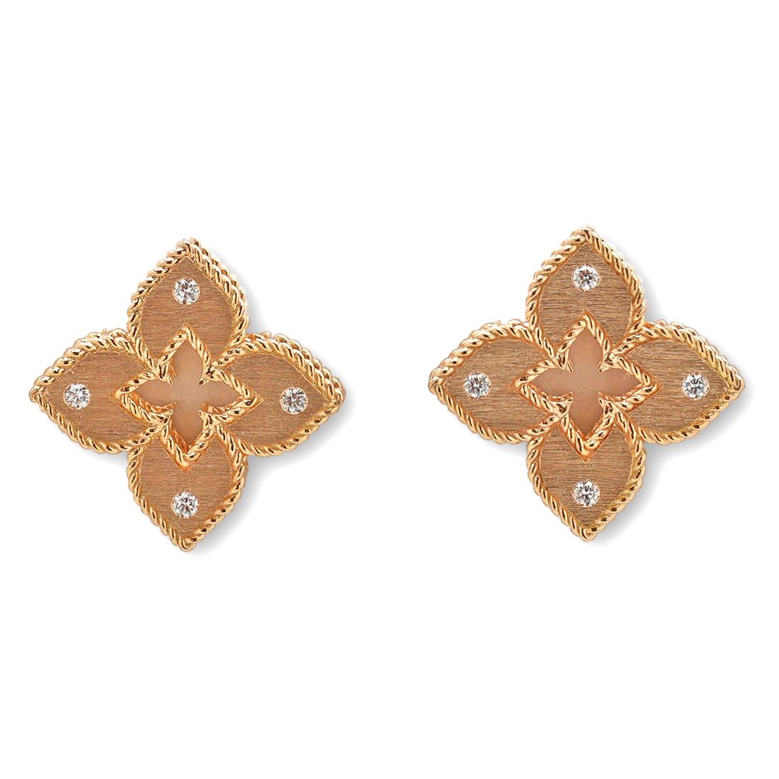 Authentic Roberto Coin 'Venetian Princess' earrings crafted in 18 karat rose gold with a brushed finish.  The quatrefoil-shaped earrings feature a rope trim and diamond accents at each of the four corners for an estimated 0.12 carats total weight. 