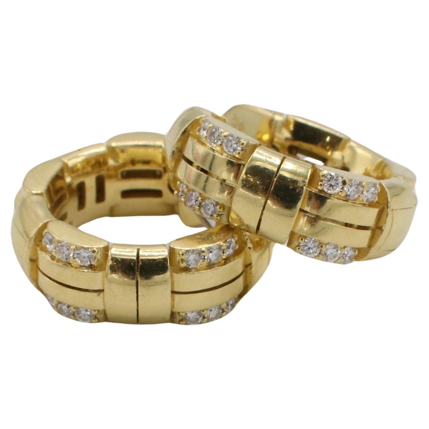 Roberto Coin Veneto Natural Diamond 18 Karat Yellow Gold Woven Hoop Earrings 
Retail: $3,320 USD
Metal: 18 karat yellow gold
Weight: 8.06 grams
Diamonds: Approx. .18 CTW natural round diamonds G VS
Diameter: 16mm
Width: 5.5mm
Signed: RC 18 KT Made