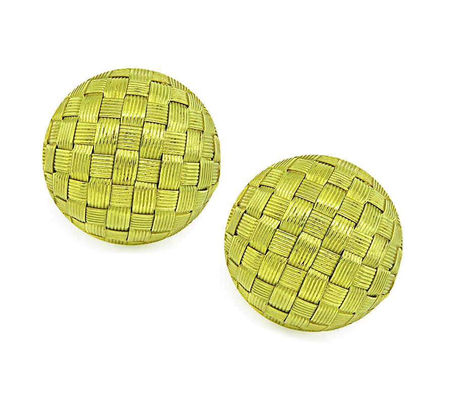 This is an elegant pair of 18k yellow gold earrings by Roberto Coin. The earrings feature impressive weave motif design. The earrings measure 23mm in diameter and weighs 15.9 grams. The earrings are stamped 18KT ITALY and is numbered. The earrings
