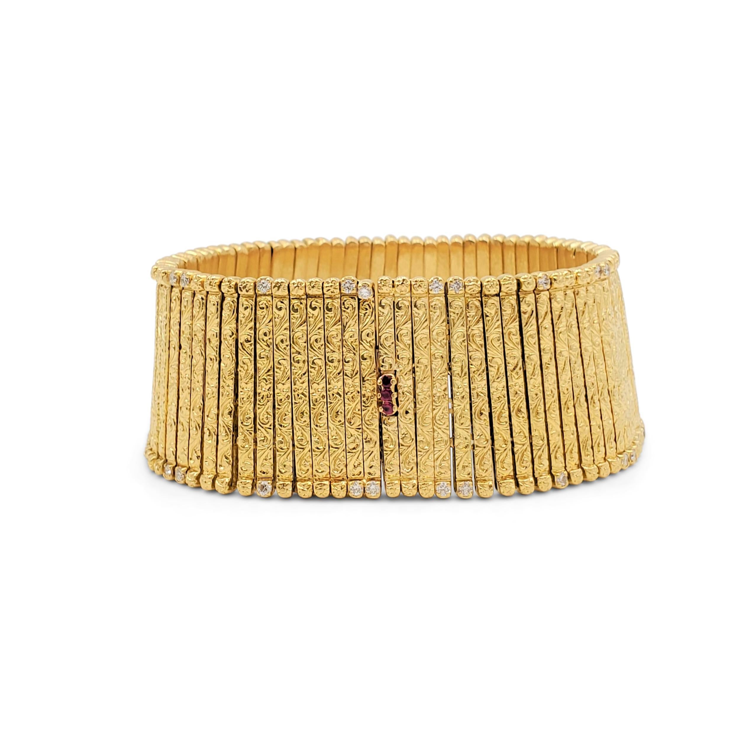 Authentic Roberto Coin flexible bracelet crafted in 18 karat yellow gold is comprised of floral engraved links highlighted by a smattering of sparkling round brilliant cut diamonds weighing an estimated 0.45 carats total weight. Three ruby stones