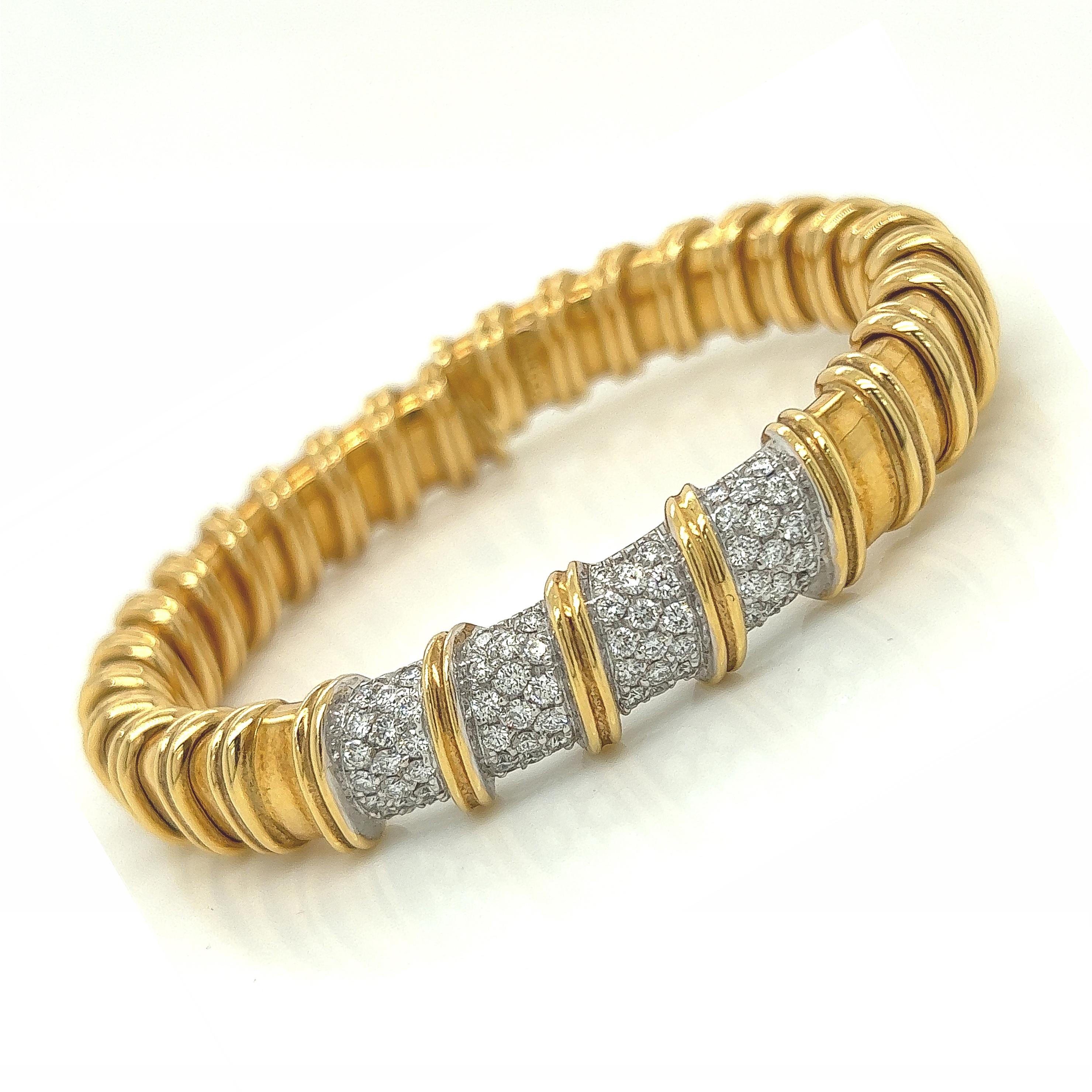Roberto Coin Yellow Gold Diamond Bangle 2.08cts

A bold accent crafted in yellow gold with a spiral design that lends immediate texture. Accented with 2.08ct in round diamonds of impeccable quality (E-F in color, VVS-VS in clarity).
Diameter:
