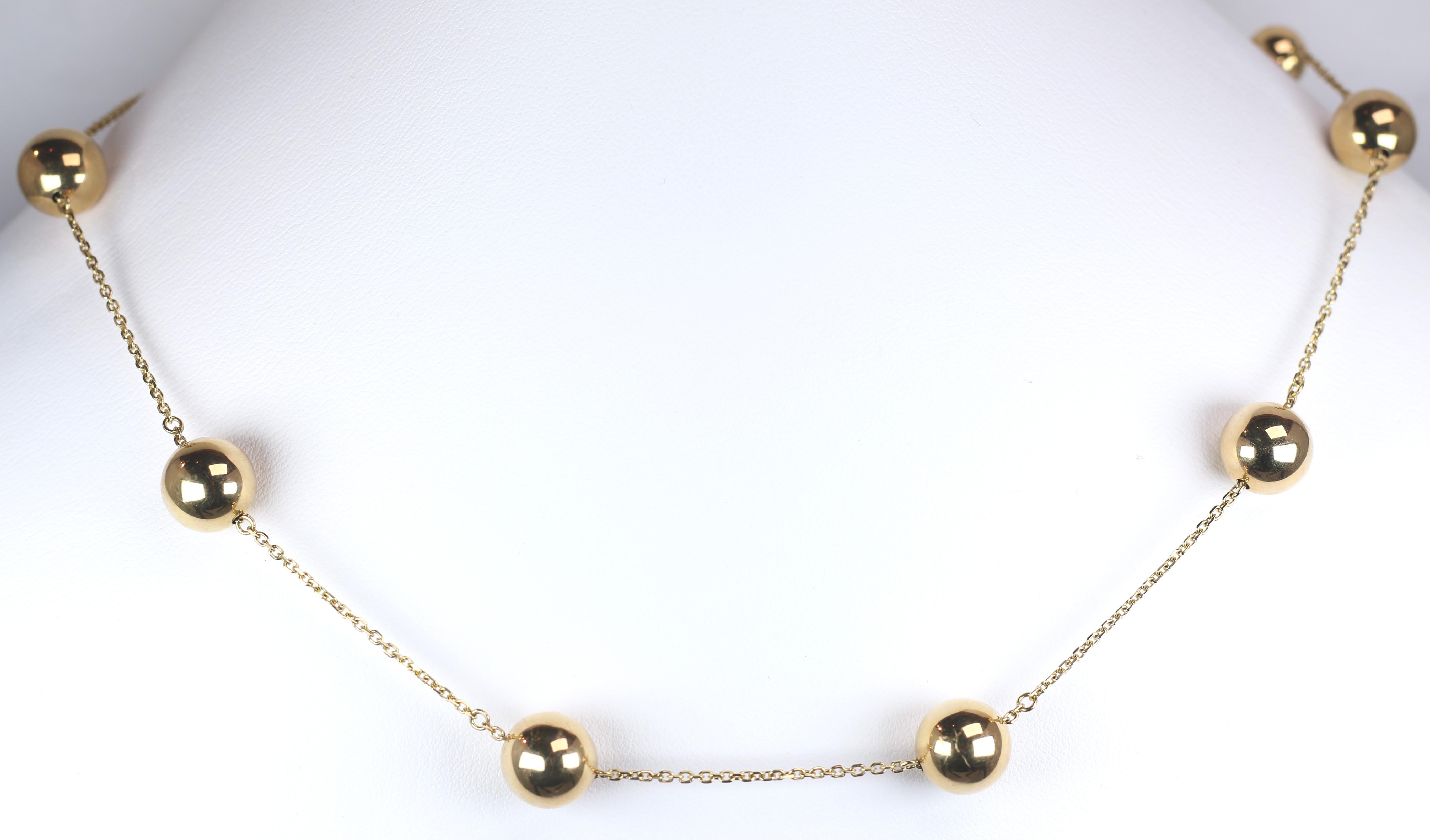 This Classically gorgeous Roberto Coin Yellow Gold Necklace with Gold Balls is a fun pop of elegance on your neck. Being roberto Coin it of course comes Featuring the Signature Hidden Ruby in the Clasp area.  A gorgeous piece to accentuate your