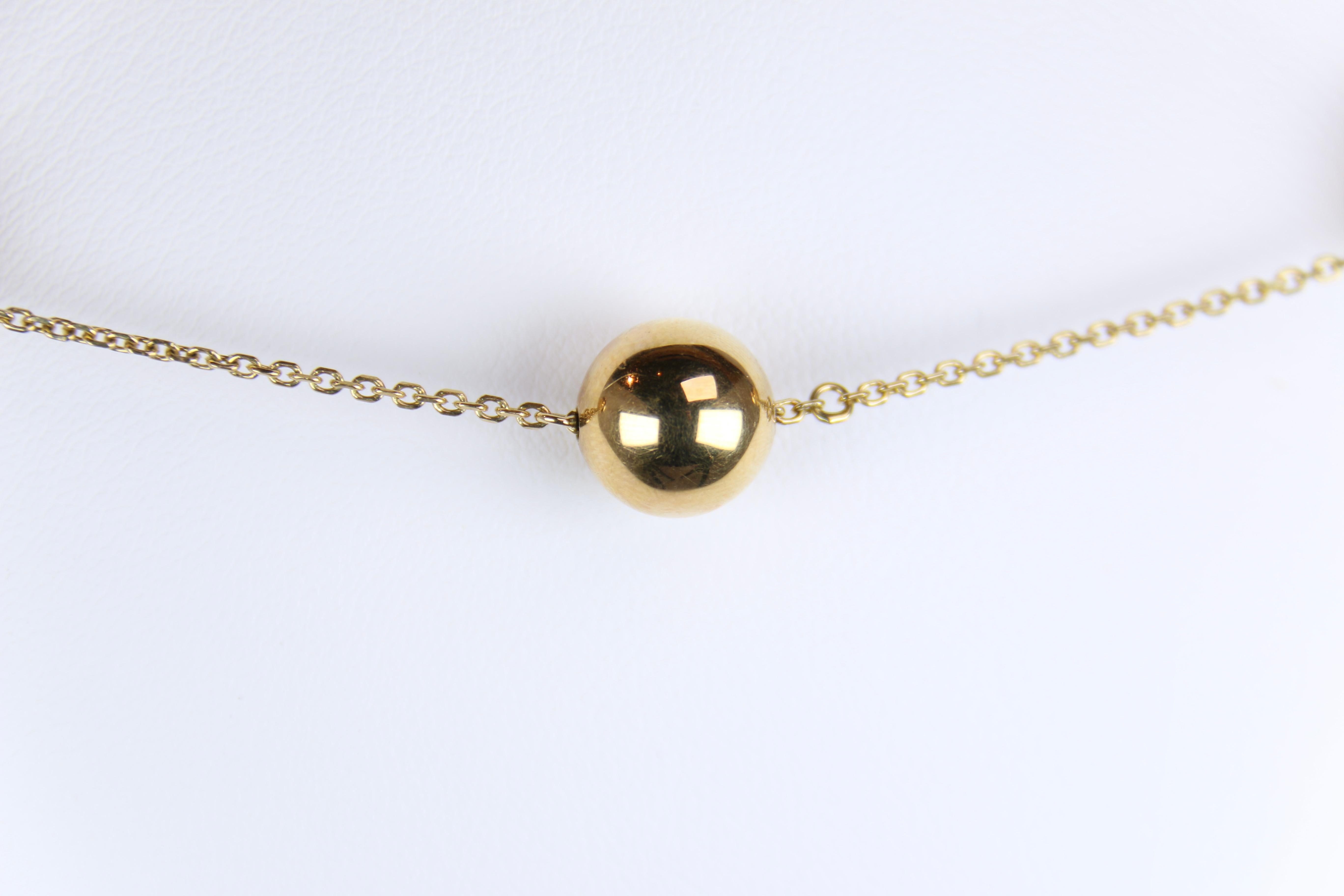 gold necklace with small balls