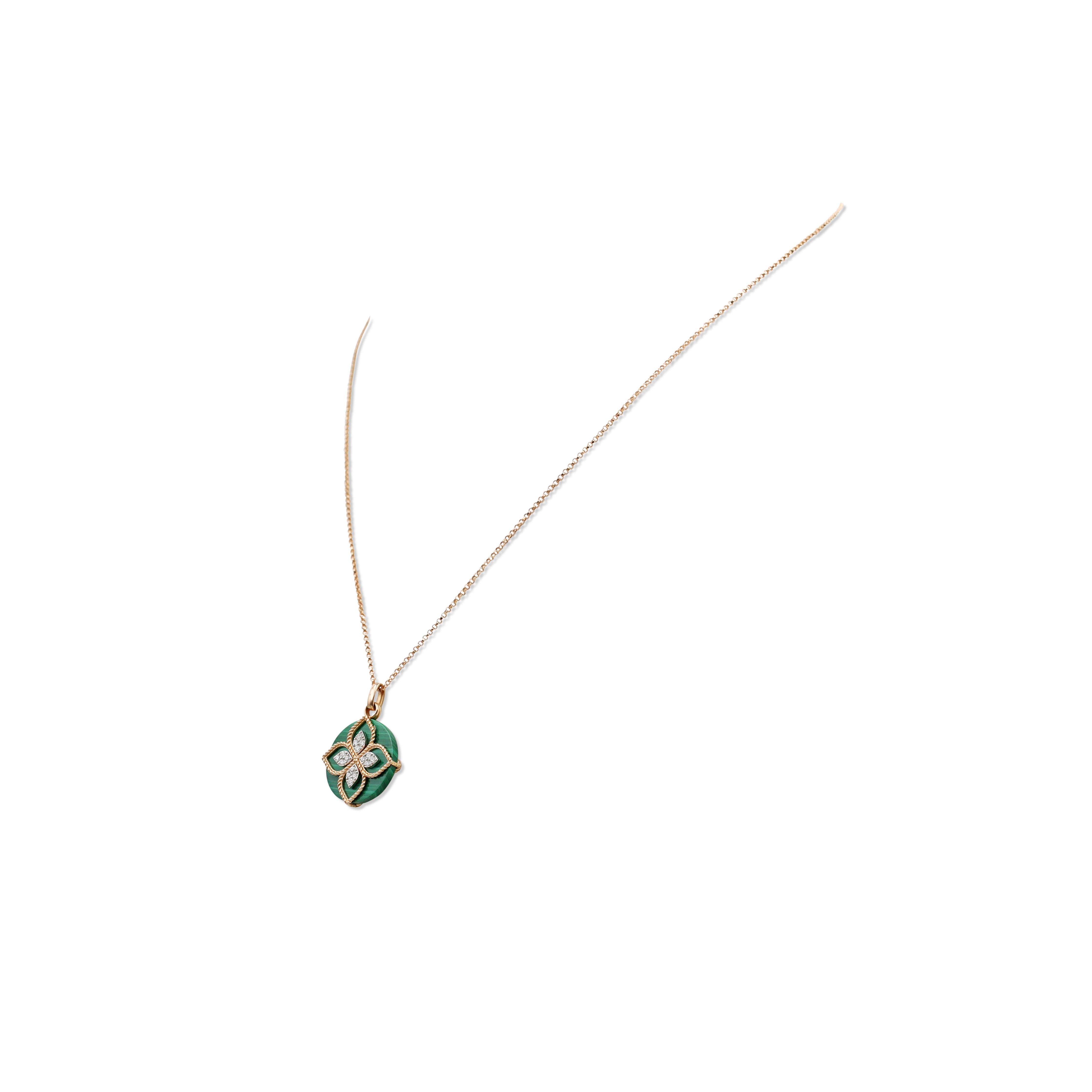 Authentic Roberto Coin pendant necklace crafted in 18 karat yellow gold and malachite.  Designed as a simplified lotus flower with petals made of chiseled golden thread, delicately placed on a malachite disk. The lotus is set with round brilliant