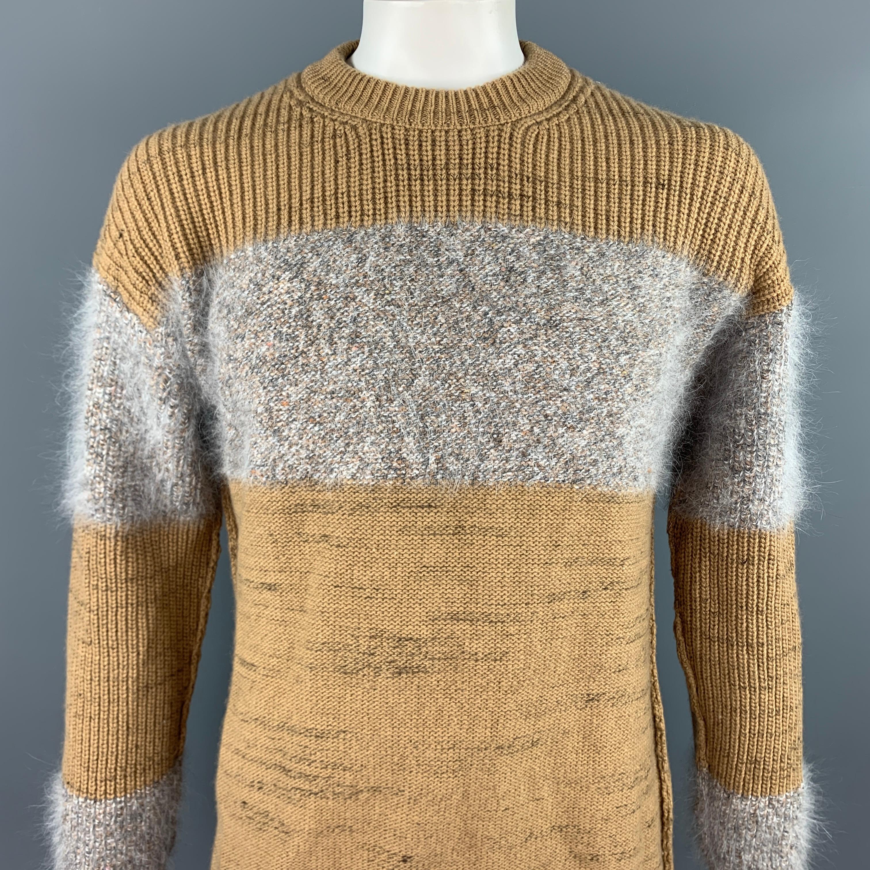 ROBERTO COLLINA sweater comes in a tan & grey knitted stripe wool blend featuring a ribbed hem and a crew-neck. Made in Italy.

Very Good Pre-Owned Condition.
Marked: IT 52

Measurements:

Shoulder: 24 in.
Chest: 44 in.
Sleeve: 25 in.
Length: 30 in. 
