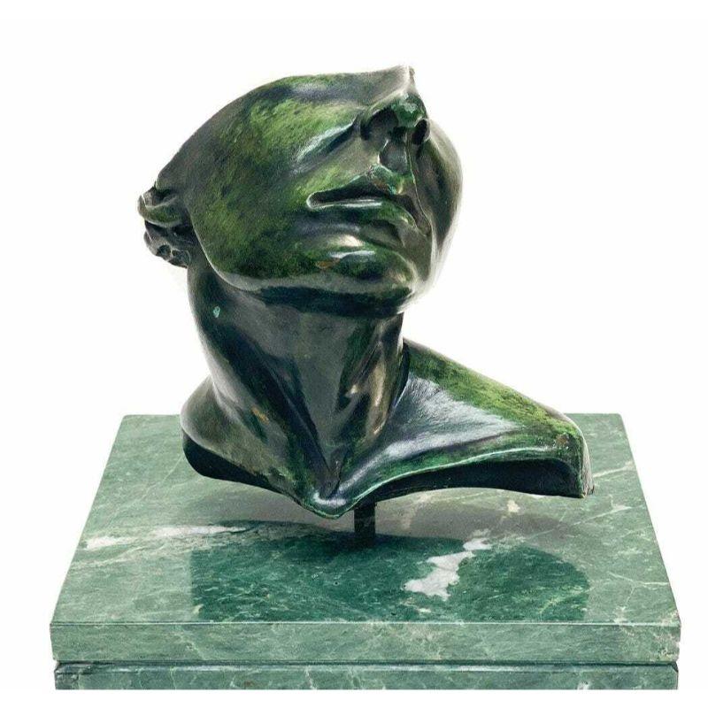 Roberto Cortazar (Mexican 20th century) Bronze Sculpture. The sculpture depicts a half face of a man. Mounted to a green marble base. Artist signed to the verso.

Additional information:
Original/Reproduction: Original 
Type: Figurines &