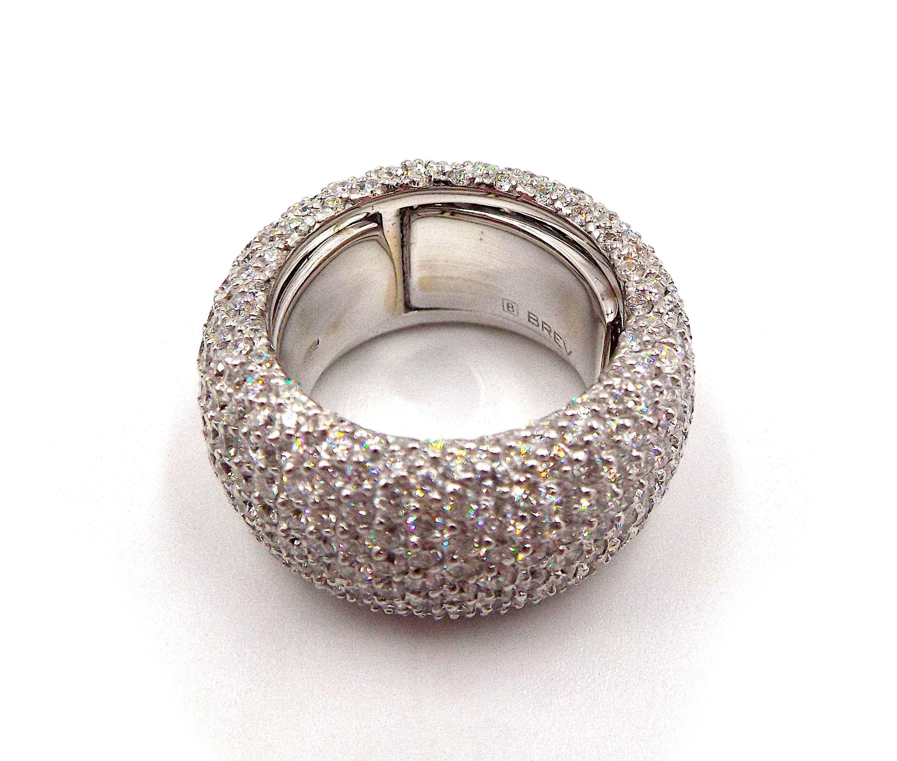 Roberto Demeglio 18K white gold and diamond ring from Cashmere collecton.
Item weight is 9.9dwt.
Diamond weight is 7.44ct.
Size 6.50 to 8 (adjustable).
Retail $21,290
The ring is pre-owned, in excellent condition.