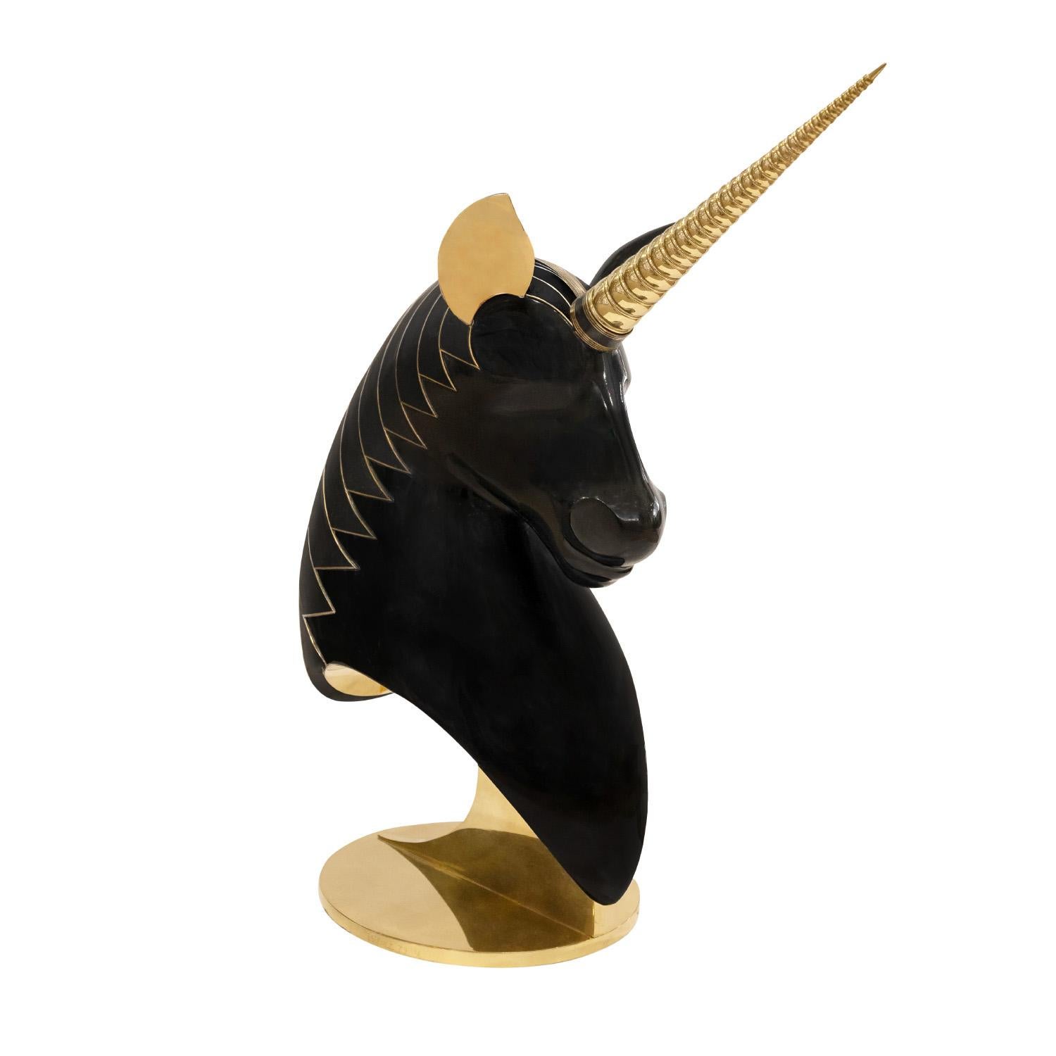 Exquisite large unicorn bust sculpture in cast resin with inlaid bronze mane, solid engraved brass alicorn, and gold leaf ears on a sculptural solid brass base by Roberto Estevez, American 1979 (signed “Estevez 79” and numbered 1/6 on base). This