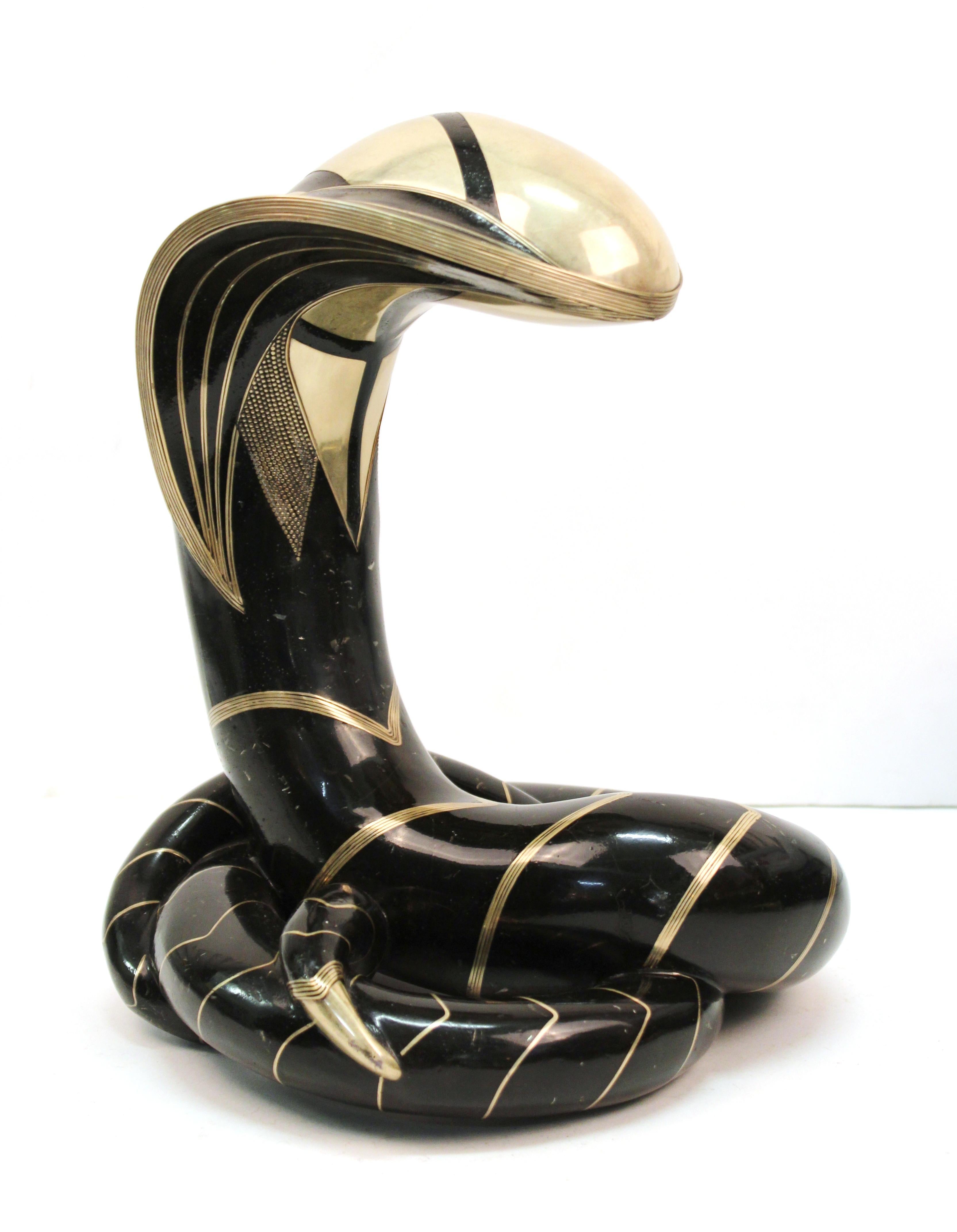 Modern 'Cobra' tabletop sculpture in hammered bronze, made by Roberto Estevez. The piece has decorative silver and brass inlay and was made in circa 1978. Estevez tag on the back collar and marking indicating edition number '3/6' on back. Roberto