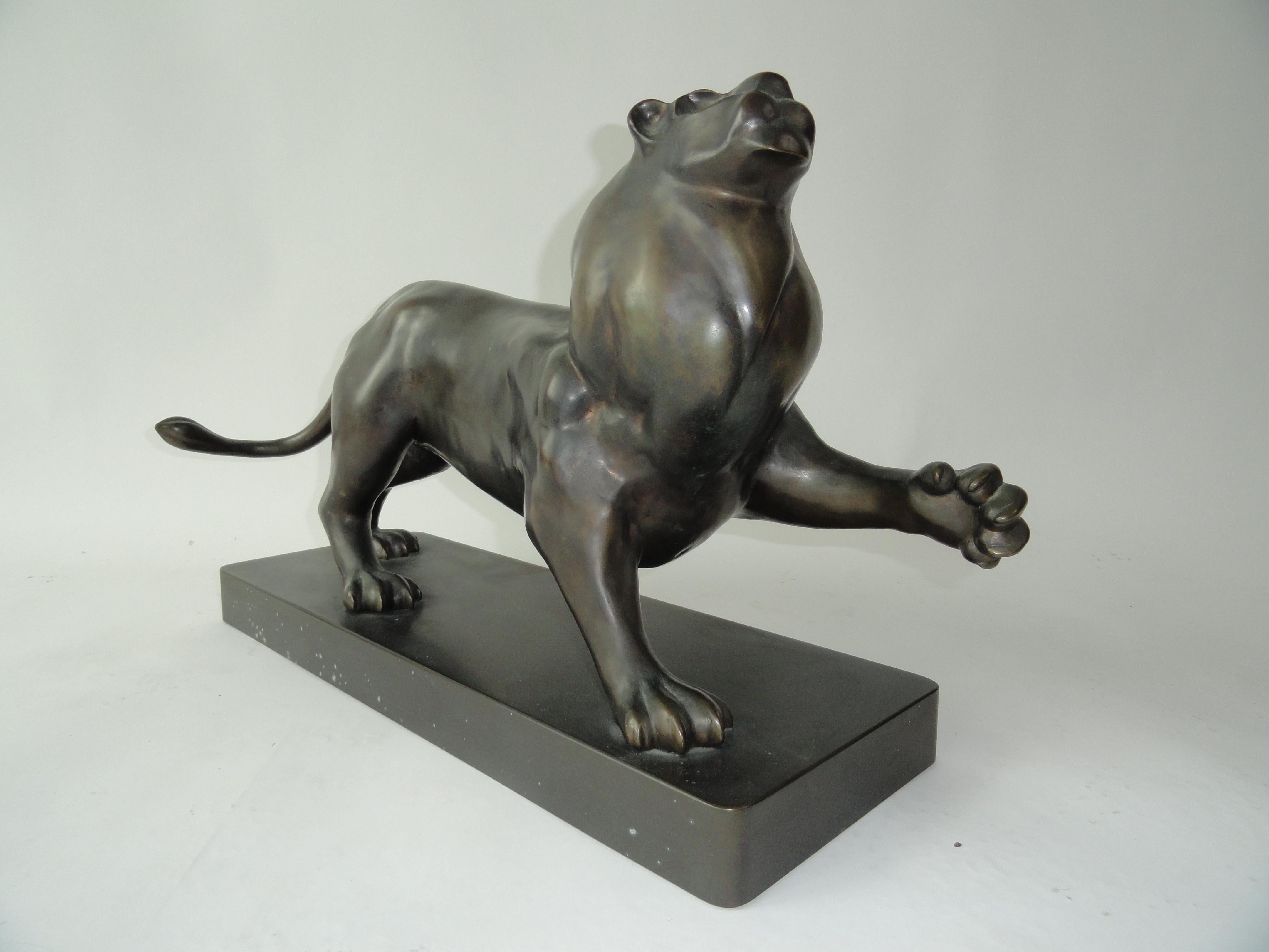 Signed Estevez by Roberto Estevez, lion in bronze. Sculpture designed for Karl Springer, New York. Model based on Pierre-Jules Mene's bronze animal sculpture of the 19th century.