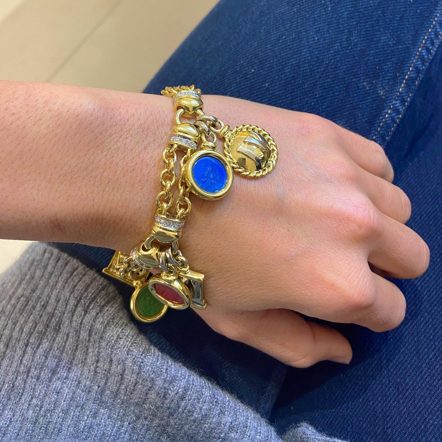 Timeless and classic charm bracelet. Designed with an 18 karat yellow gold and diamond link chain .The charms include 4 enameled peso's coin charms , along with important European and American hallmarks. The bracelet measures 7.25