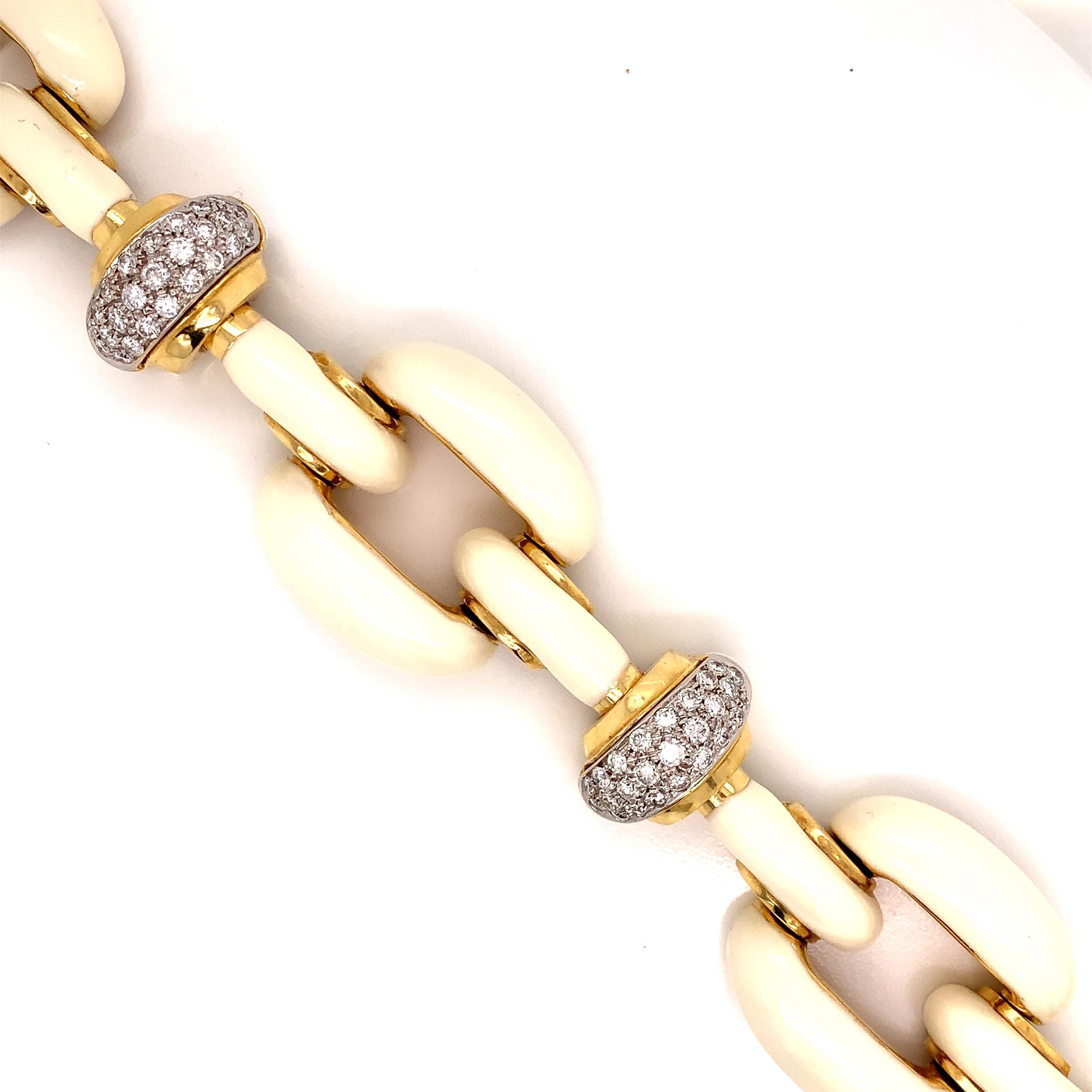 Creamy winter white enamel paired with 4.20 cttw diamonds and 66.40 grams of 18kt yellow gold make for a spectacular combination.  This Italian designed Roberto Legnazzi bracelet is beautifully made with fine attention to detail. This 7.25