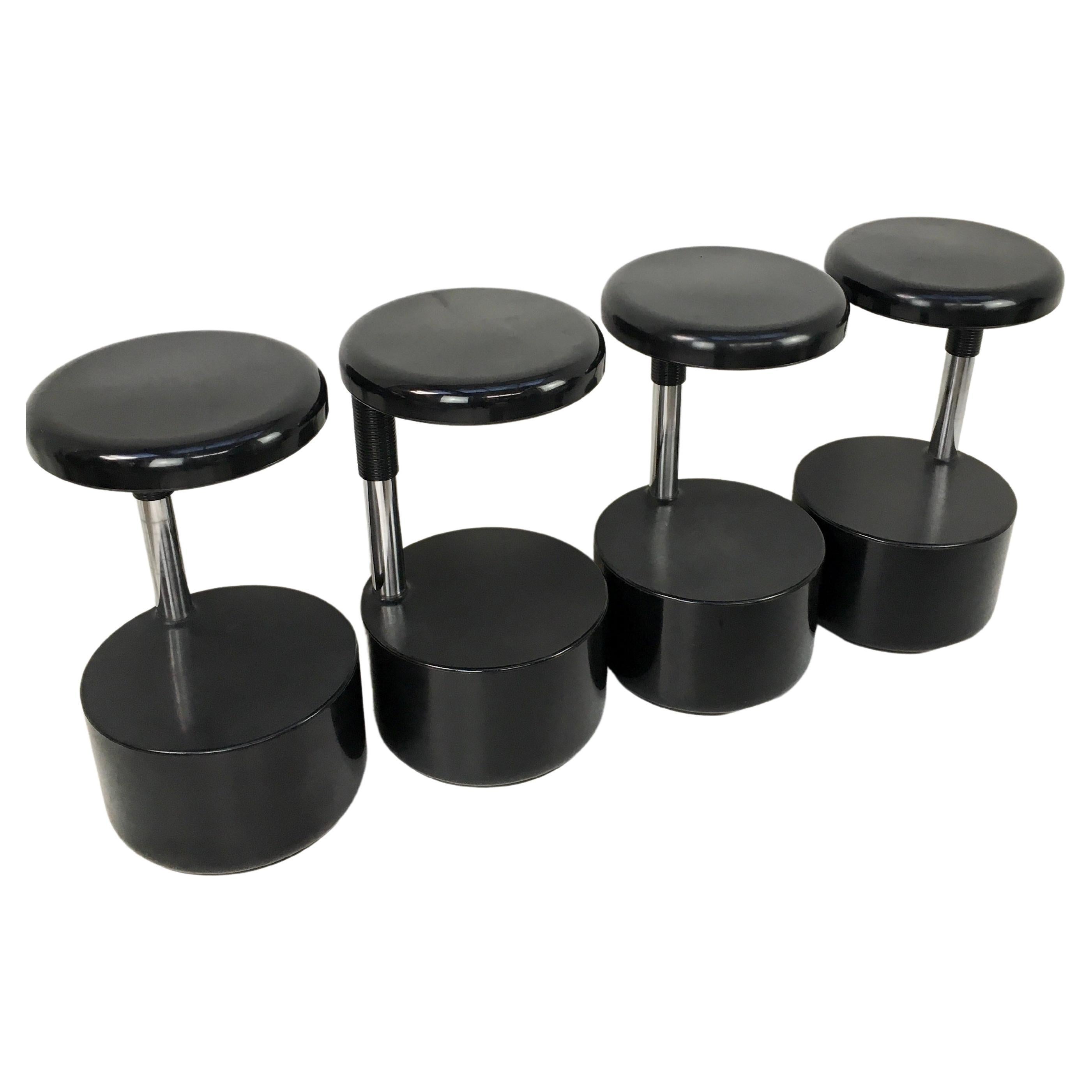 Italian design, set of four black ‘Golf’ bar stools. Designed by Roberto Lucci and Paolo Orlandini for Velca Legnano. 

They have a clever height adjustment hidden under seat. Seat height range is 60cm to 74cm. 

Labels intact under seats. 

Made in