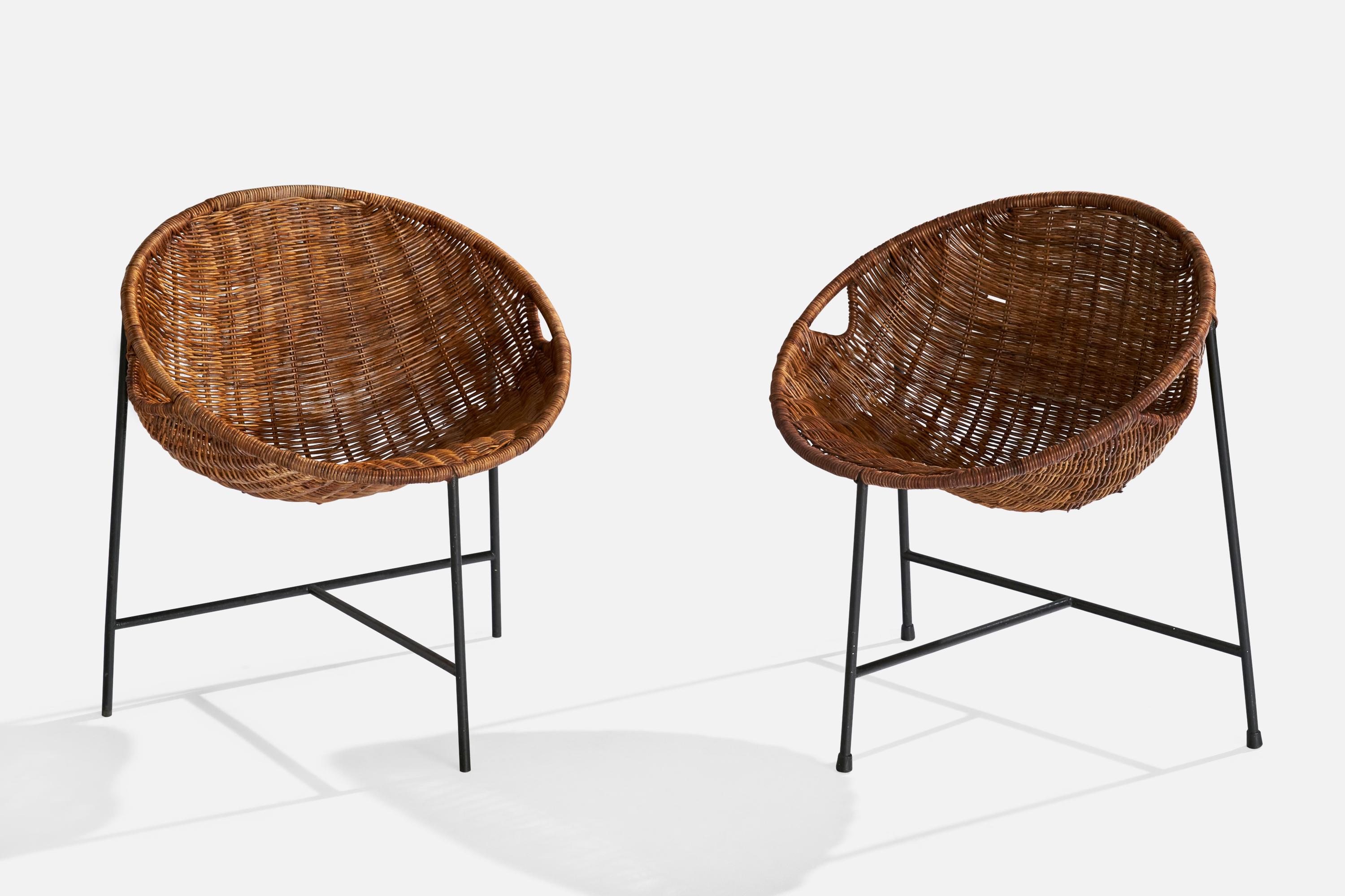 A pair of black-painted iron and rattan side chairs designed by Roberto Mango, Italy, c. 1950s.

Seat height: 12