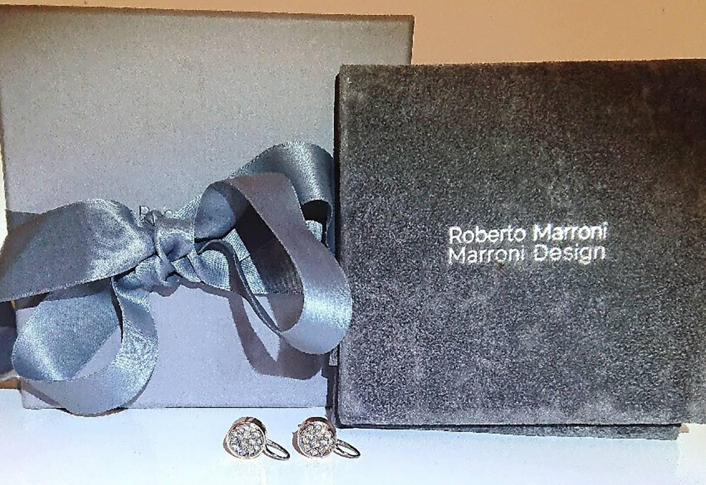 An amazing pair of Diamond earrings from Italian Jewellery Designer Roberto Marroni.
Featuring an 18ct rose gold drum with a selection of varied size Chocolate Diamonds.
Original price £3200.00
Brand new and unworn with signature box and pouch.