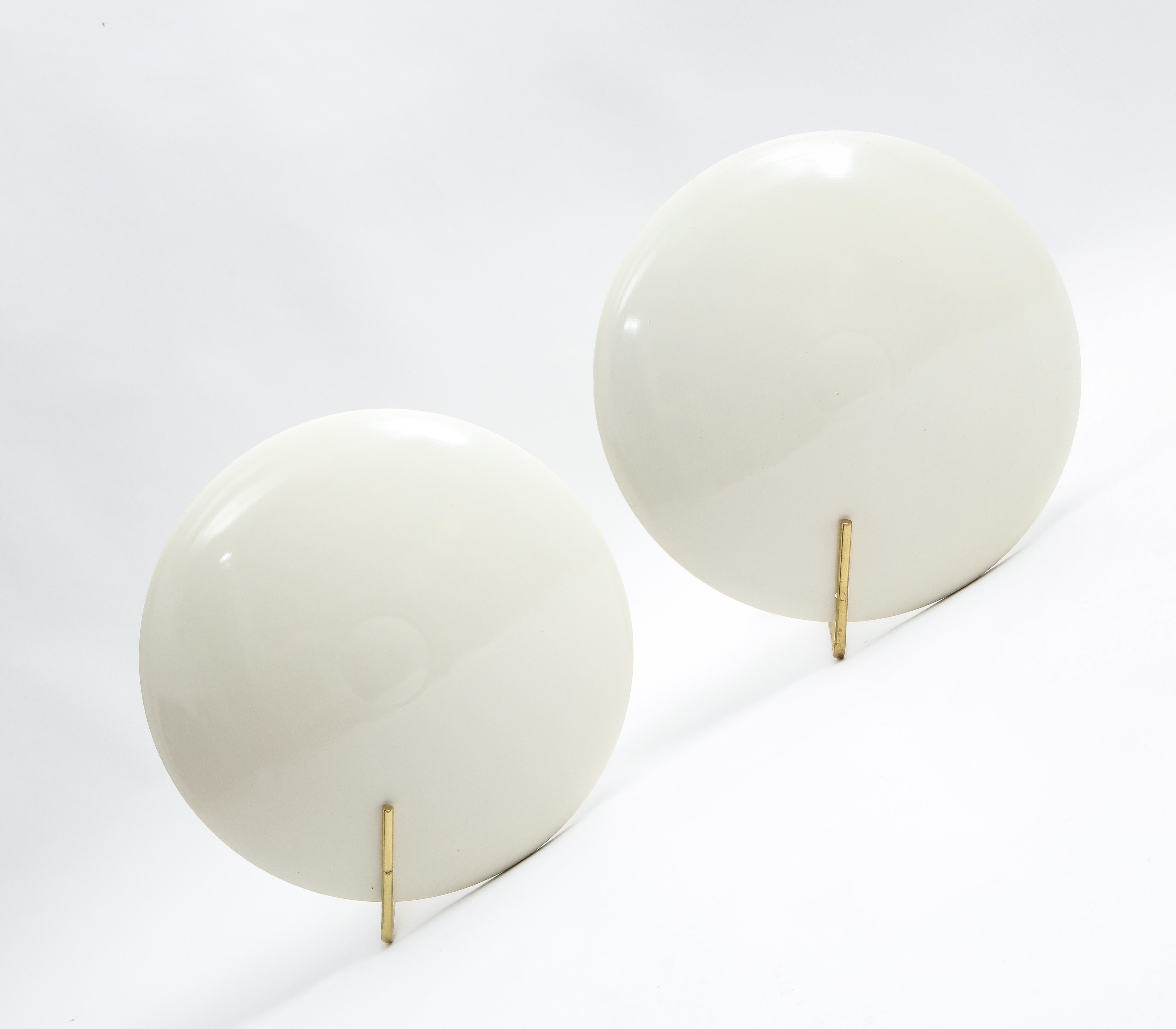 A pair of enameled aluminum and brass sconces by Roberto Matta for Arredoluce, they can also be used as ceiling fixtures.