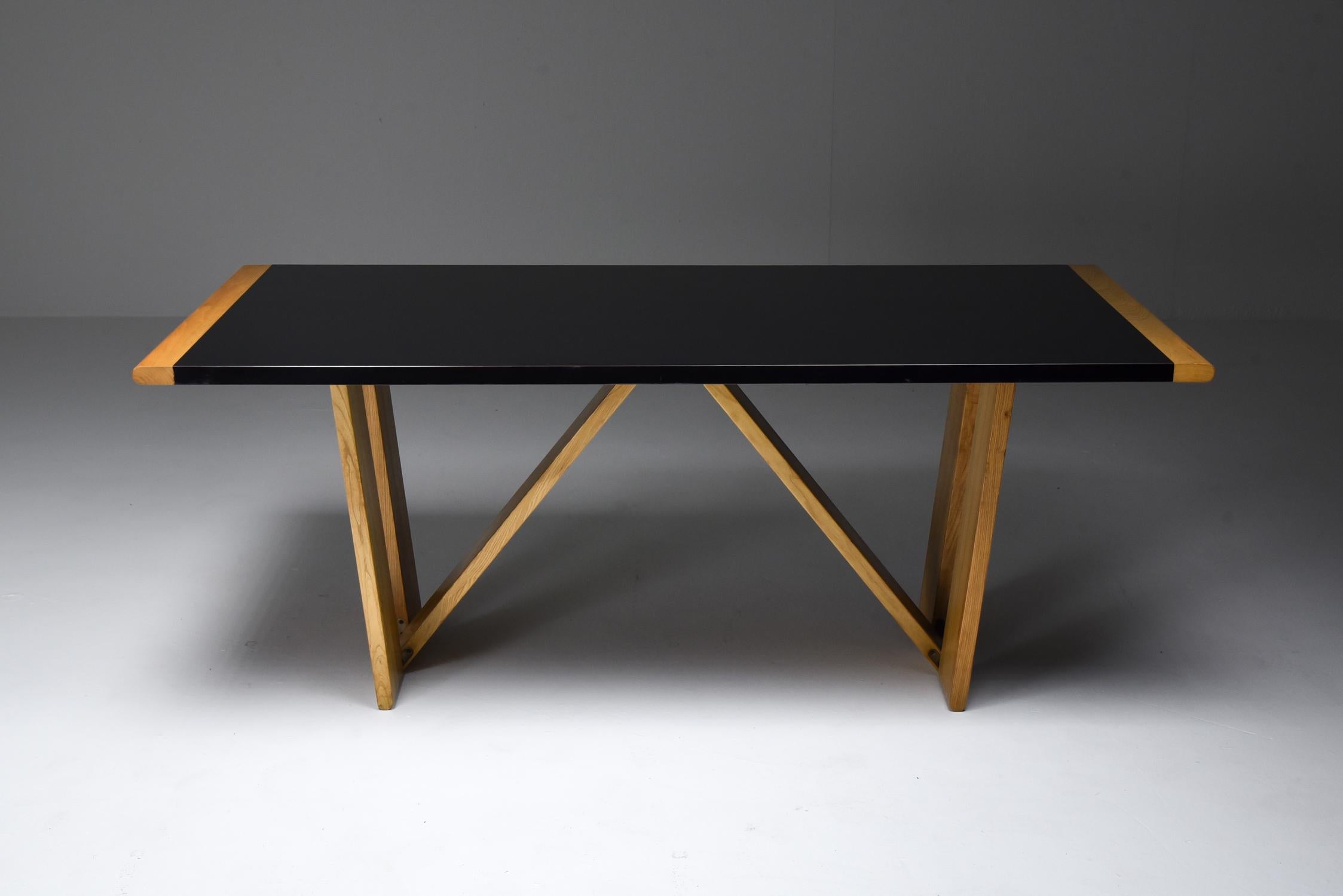 Roberto Pamio and Renato Toso, dining table, Stilwood, Italy, 1972

Unusual post-modern Italian table in black Formica and blonde wood.
post-modern and high-end play of a trestle table by the avant-garde designers Roberto Pamio and Renato