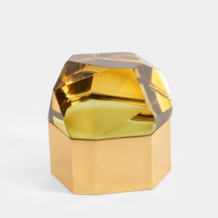 Roberto Giulio Rida exquisite amber-chartreuse 'Diamante Murano' glass box with thick glass ground and polished to create faceted fitted top with gilt brass base covered inside with steel, Italy, 2017.  The glass is made of crystal glass core, then