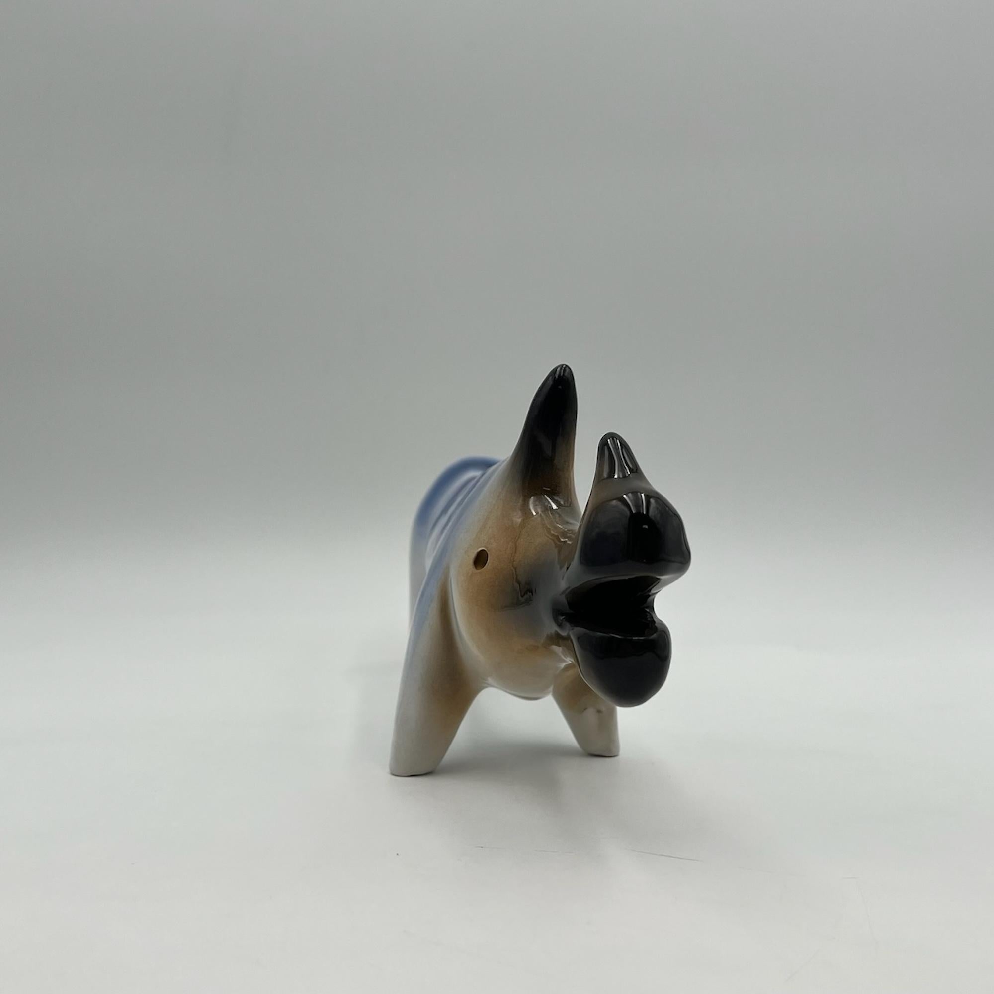 Immerse yourself in the captivating world of space age aesthetics with this exceptional vintage ceramic figurine crafted by the renowned Italian artist Roberto Rigon in the 1970s. This handmade sculpture, depicting a rhinoceros, is a stunning blend