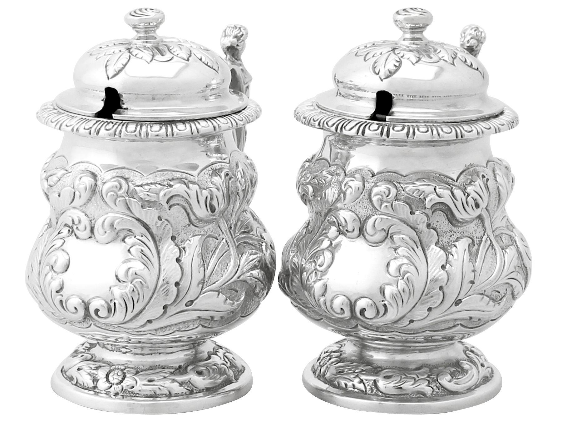 An exceptional, fine and impressive pair of antique George V English sterling silver mustard pots, an addition to our silver cruet and condiments collection.

These exceptional antique George V sterling silver mustard pots have a circular baluster