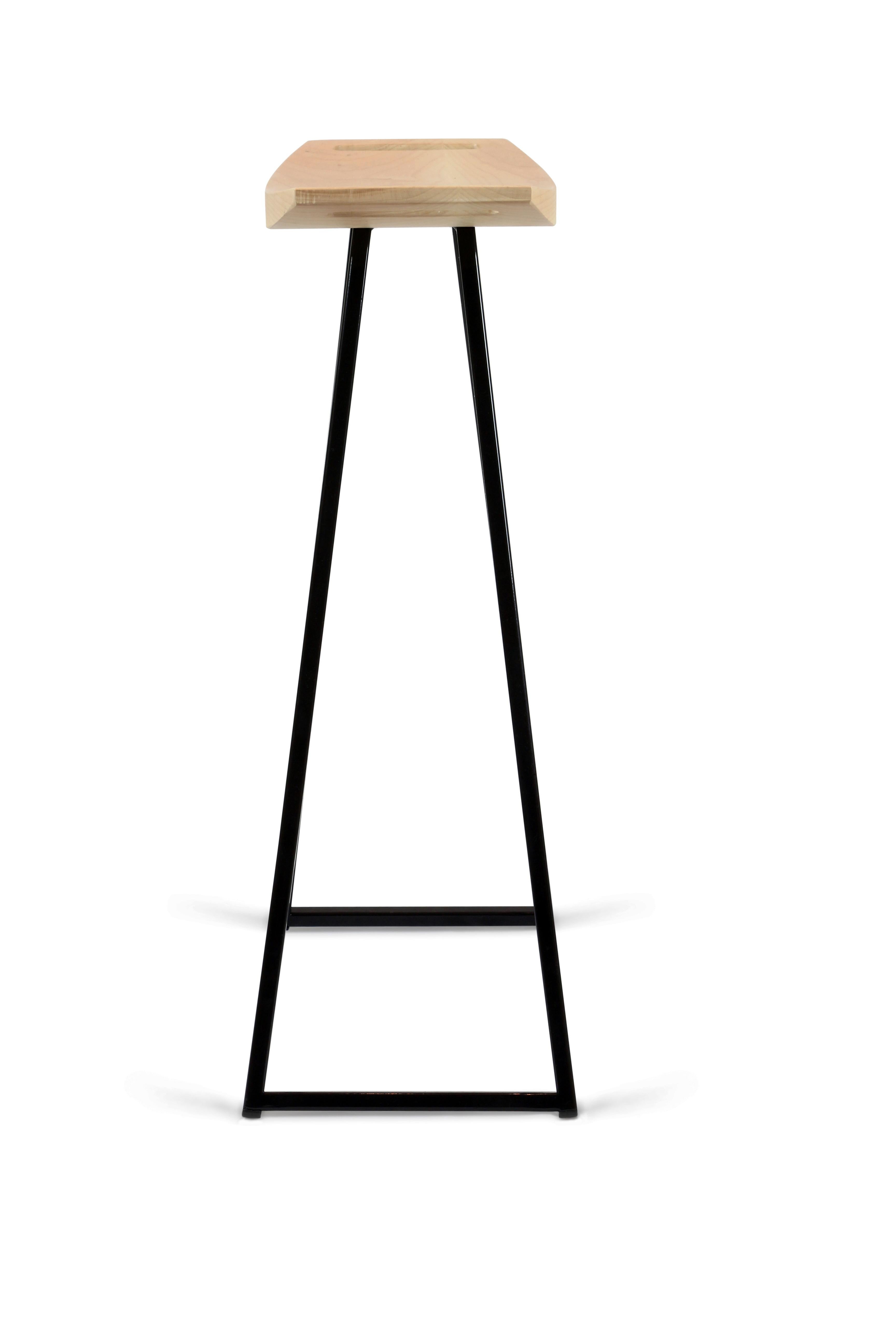 This sleek stool has a thin carved wooden seat that rests on a steel tubing base. The elegant seat is curved for seamless comfort while displaying a stunning intersecting diagonal accent inlay. This eye-catching and durable piece will make any