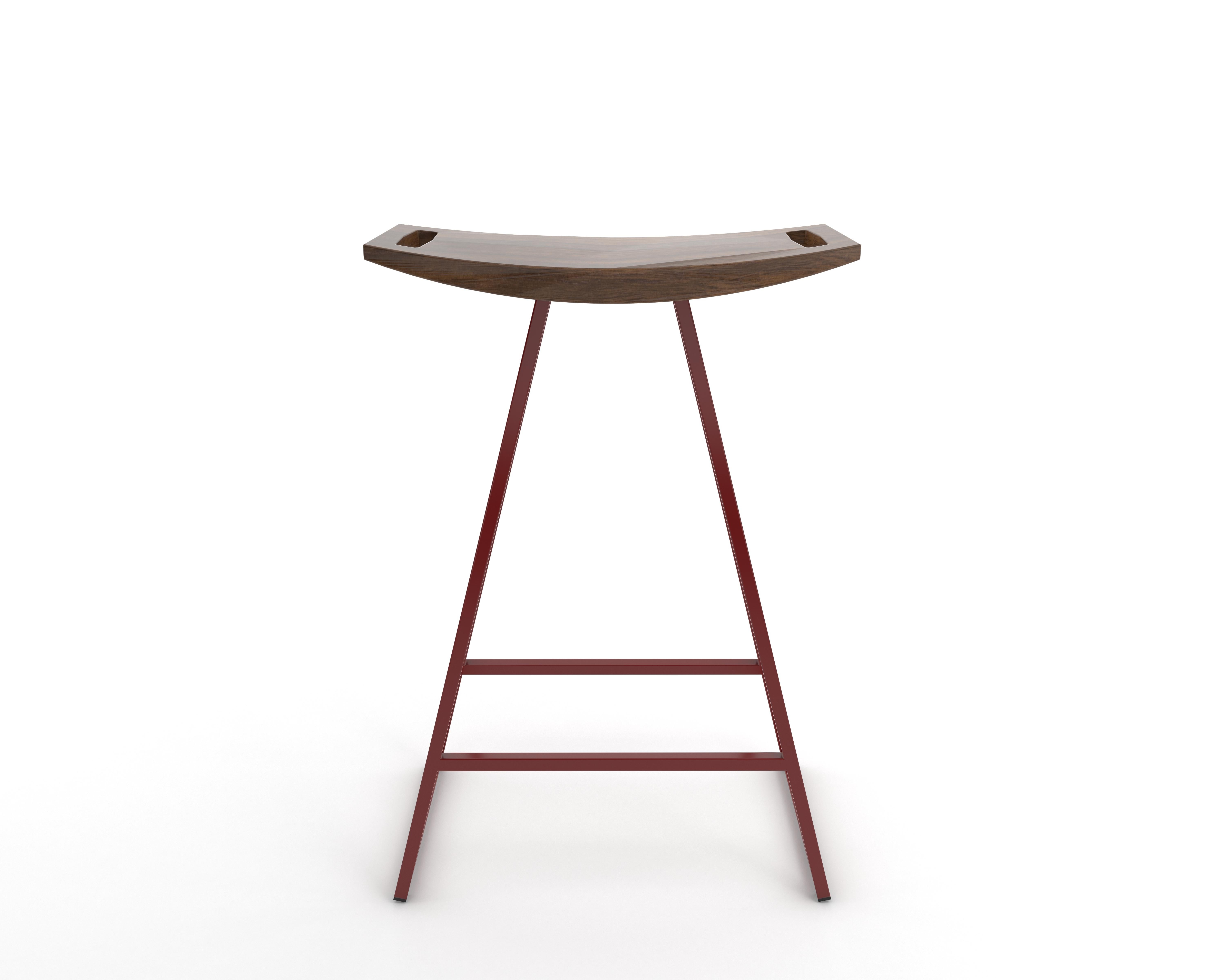 This sleek stool has a thin carved wooden seat that rests on a steel tubing base. The elegant seat is curved for seamless comfort while displaying a stunning intersecting diagonal accent inlay. This eye-catching and durable piece will make any