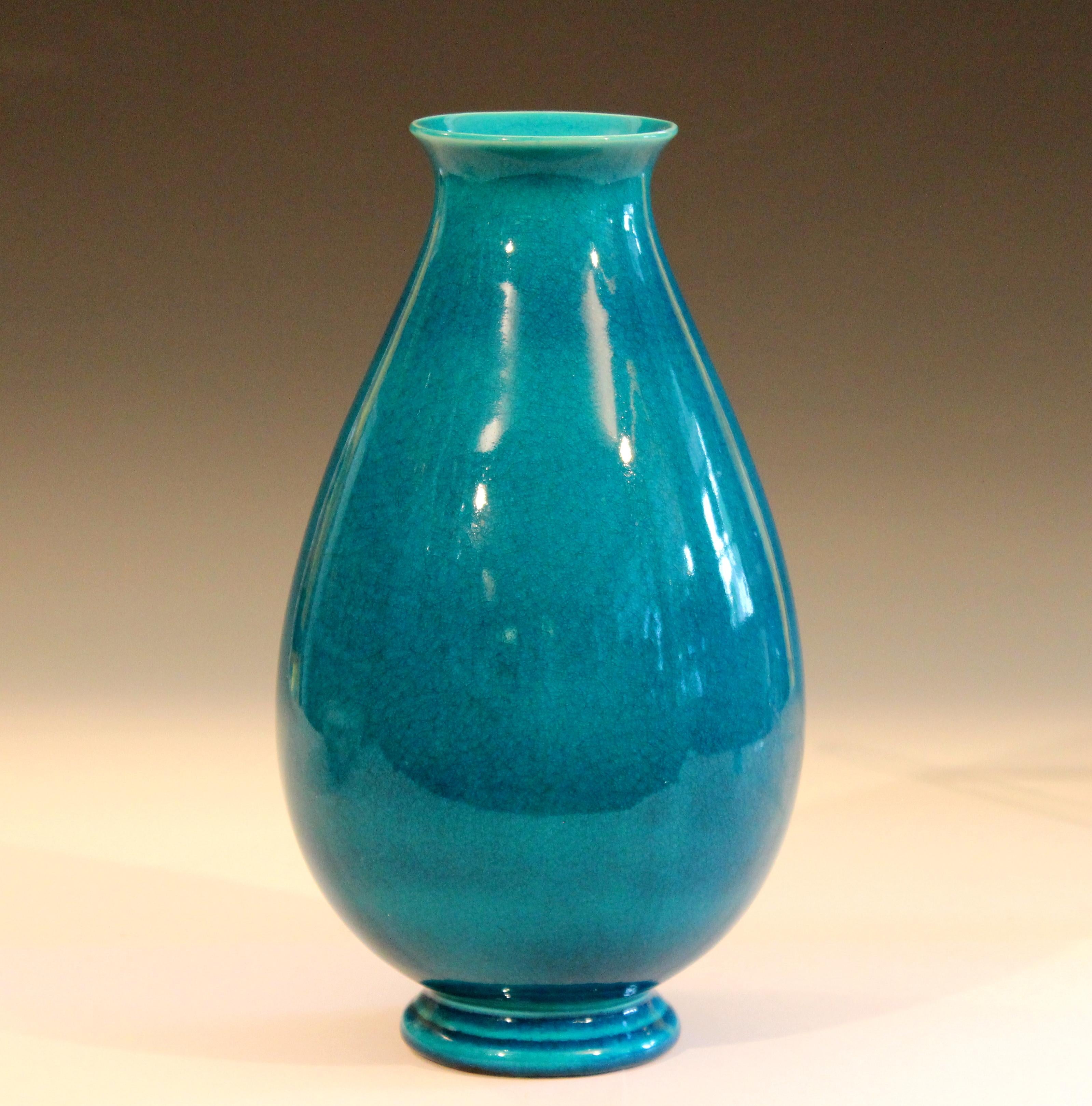 Vintage Robertson Hollywood pottery vase in sensuous and organic form with brilliant turquoise crackle glaze, circa early 20th century. Measures: 11 1/2