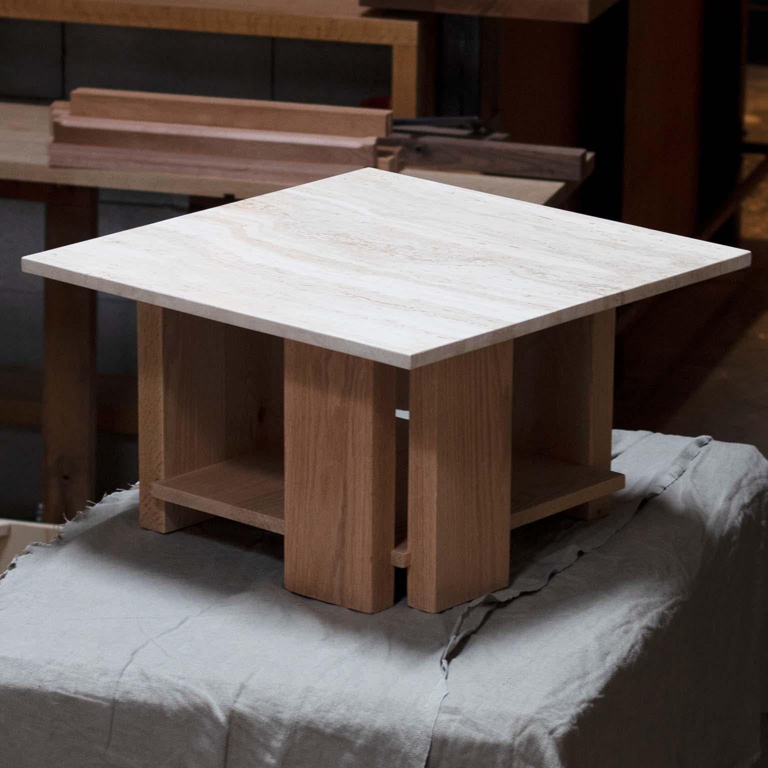 The Robie table is inspired by the design of the Robie House, by Frank Lloyd Wright. A, asymmetrical, cantilevered design creates movement and interest in a design that comprised of linear shapes. The travertine top is stunning, especially when