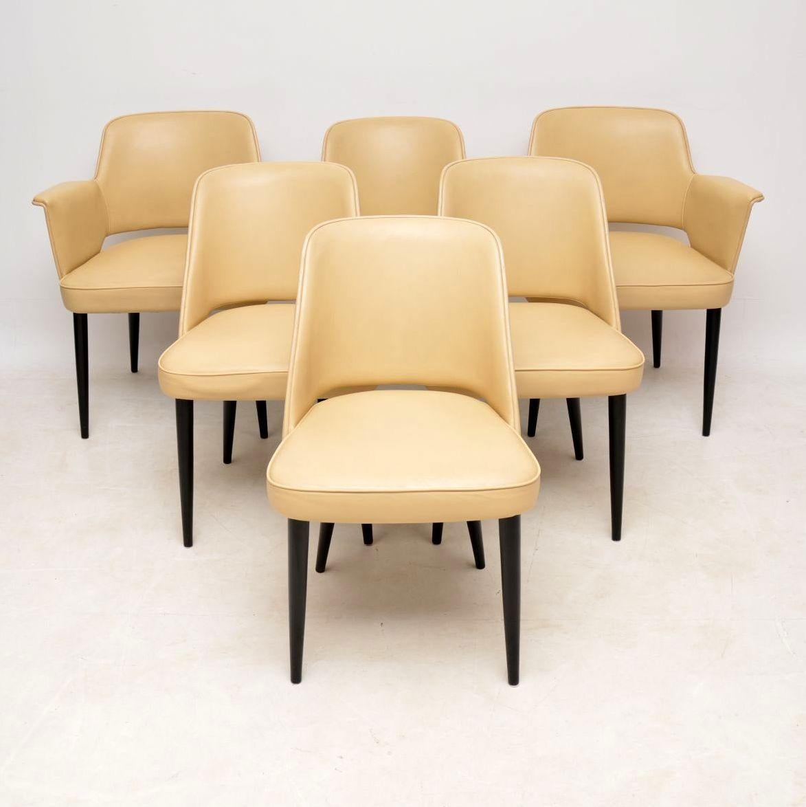 An exceptionally rare and high quality dining table and chairs, this was designed by Robin Day and made by Hille in the 1950-60’s.

The chair model is called the ‘Stamford’ chair, they are all upholstered in cream leather with ebonised wooden