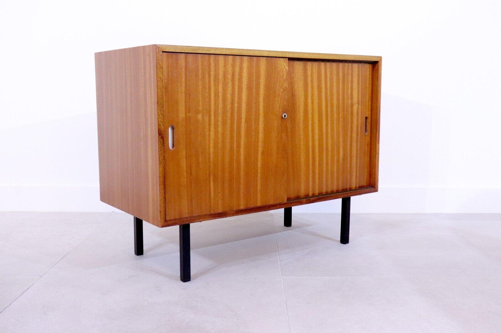 Teakwood cupboard, Robin Day, 1950s; with 4 drawers on the left side, ideal for file storage, and a large open cabinet on the right. Sliding doors allow for easy accessibility. This cabinet would be ideal for an office, but has uses in many other