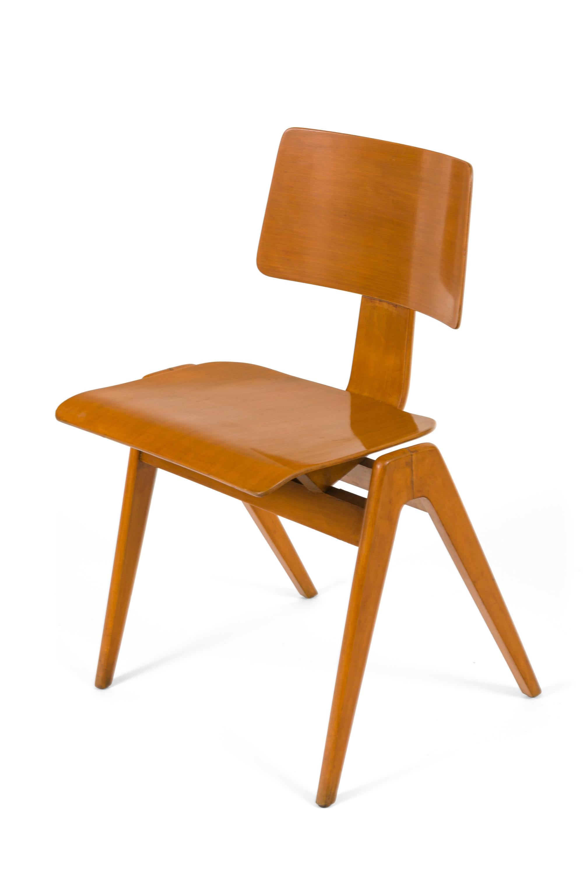 Robin Day was an iconic British industrial designer. The Hille furniture company was in business in London since 1906. In 1949 they hired Robin Day to design low-cost furniture resulting in the Hillestak Chair. He rose to prominence in 1951 when he