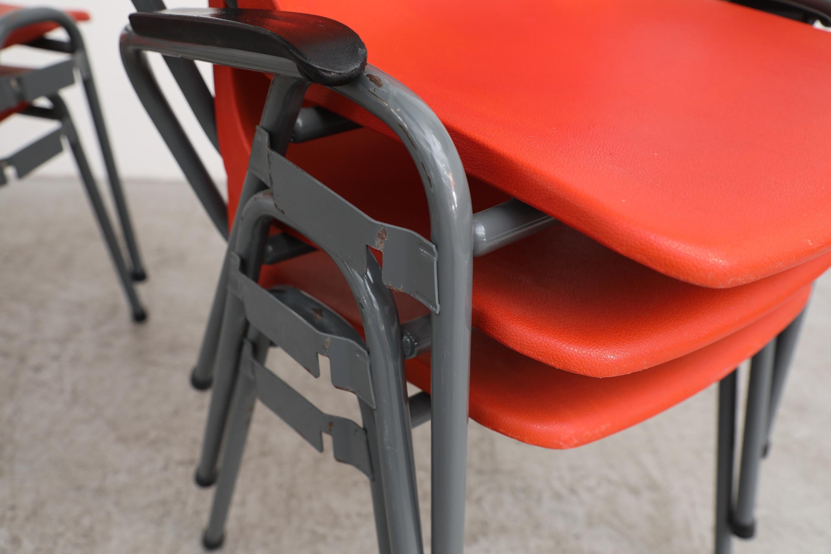Robin Day Inspired Red Plastic Stacking Arm Chairs with Gray Metal Legs For Sale 4