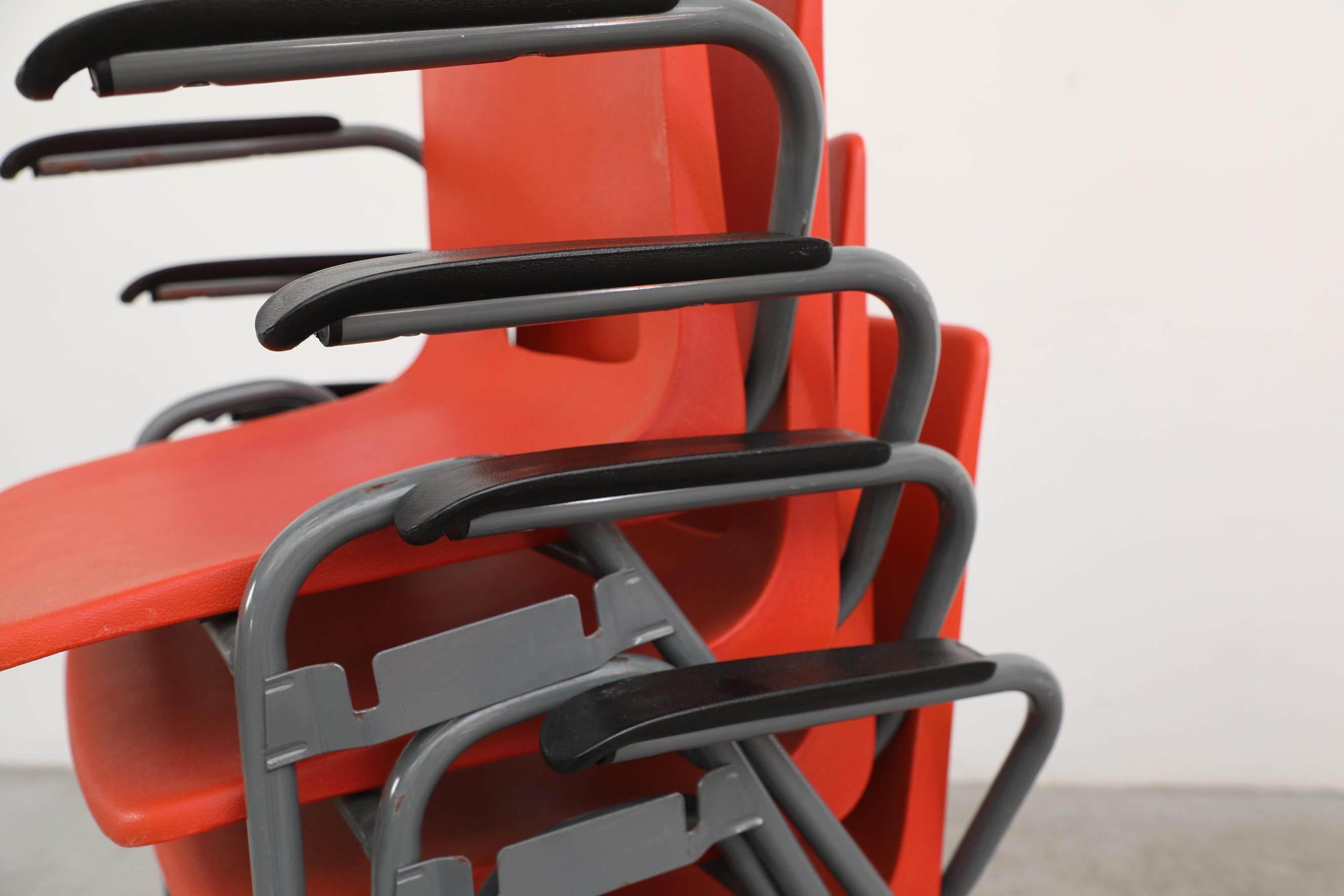 Robin Day Inspired Red Plastic Stacking Arm Chairs with Gray Metal Legs For Sale 10