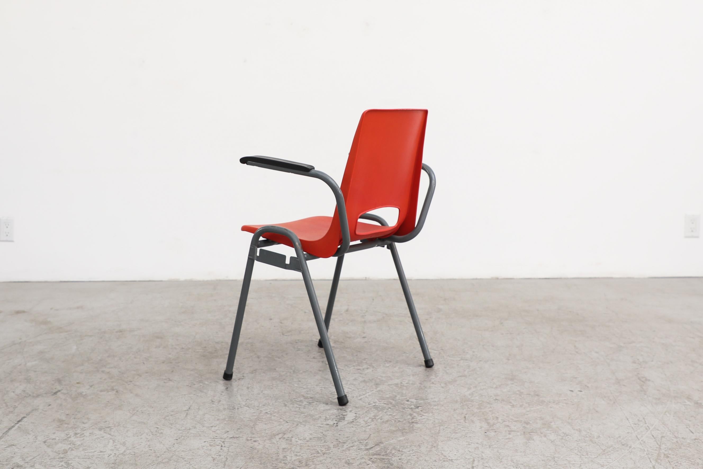 Robin Day Inspired Red Plastic Stacking Arm Chairs with Gray Metal Legs In Good Condition For Sale In Los Angeles, CA