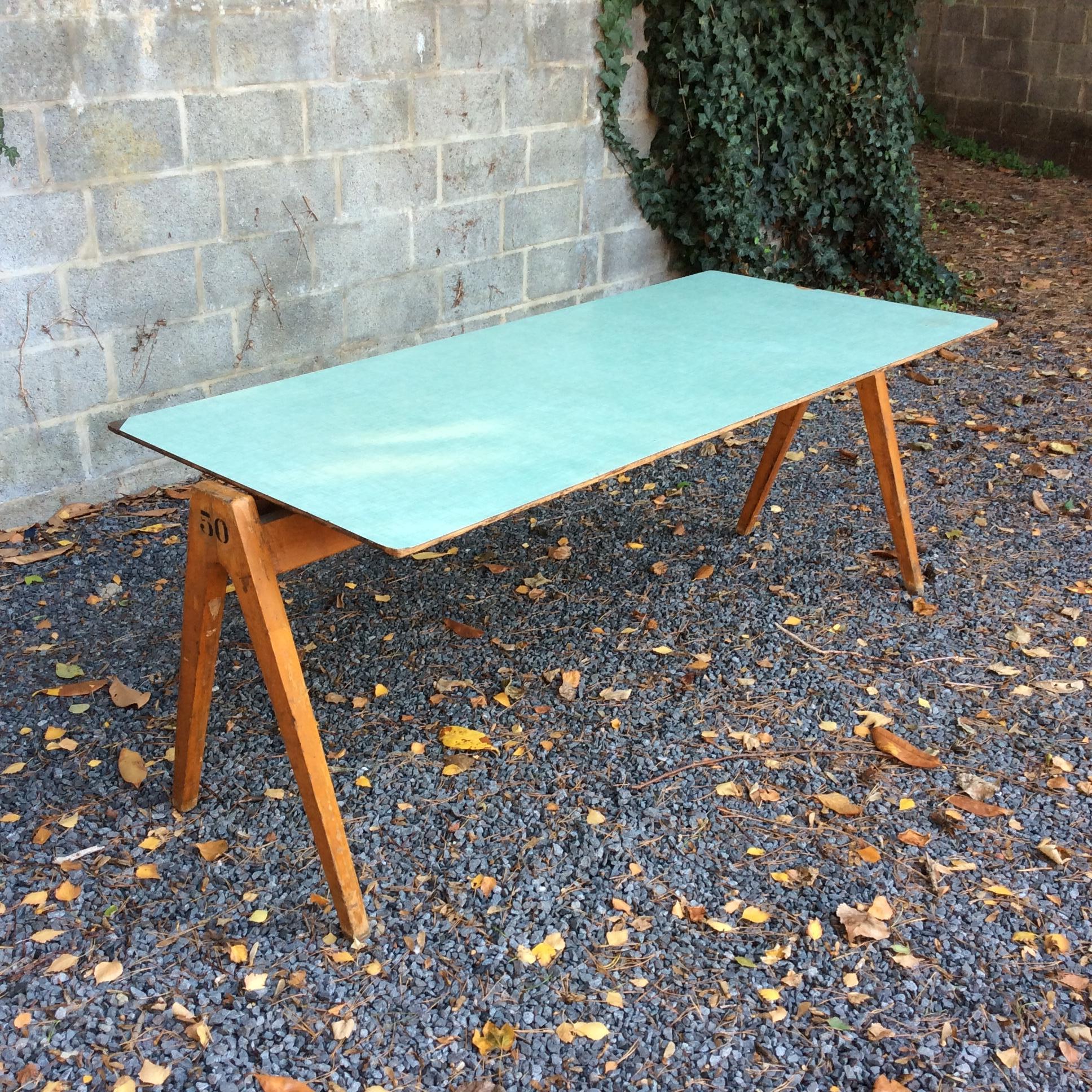 Robin Day large table, circa 1950, United Kingdom, edited by Hille.
Beech wood and pale green original formica.
Dimensions: 180 cm W, 80 cm D, 72 cm H.
Original condition.
We ship worldwide.