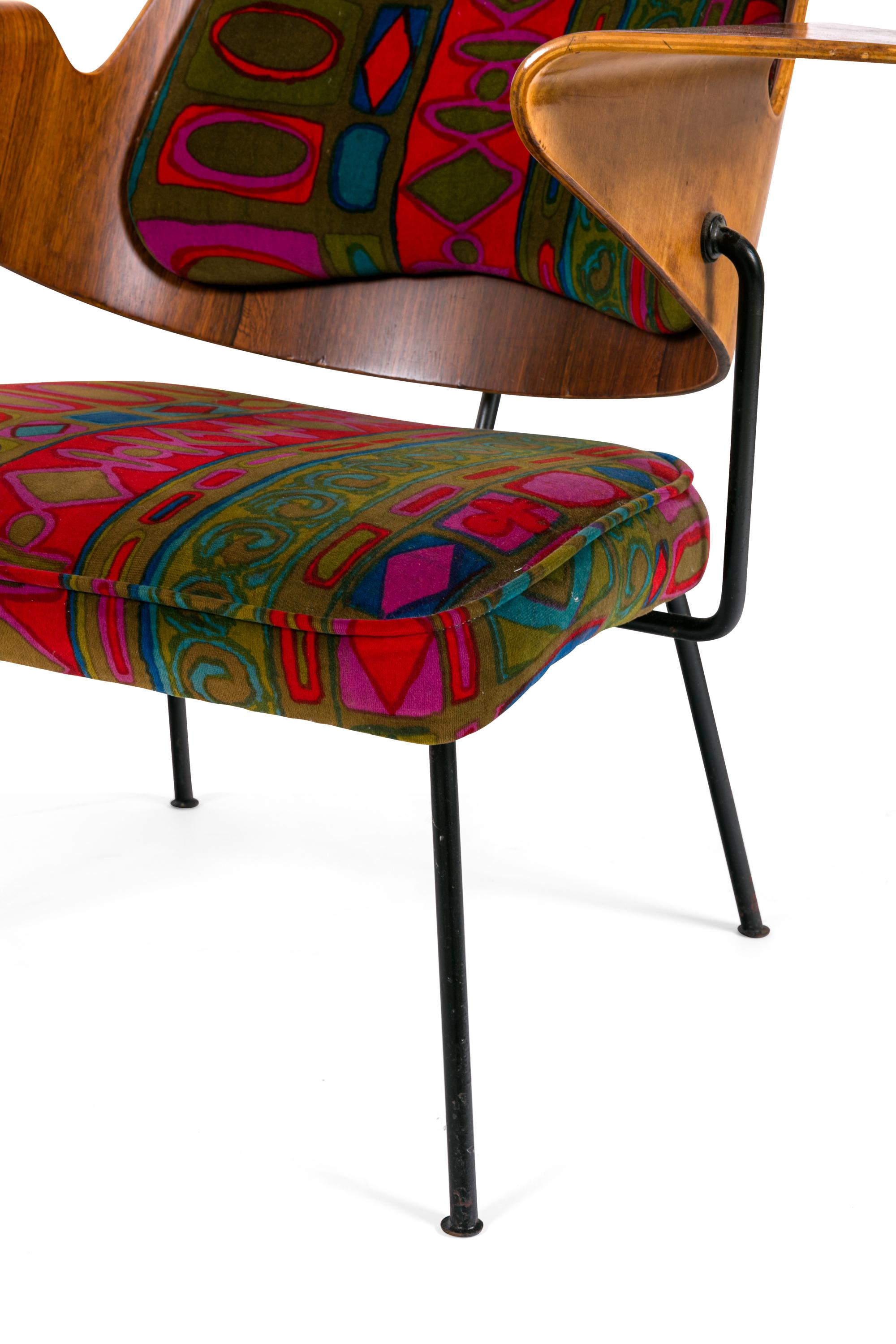This epitomizes the revolutionary new aesthetic of the post-war style. Its period upholstery, organic sculptural seat back and minimalist frame makes it unlike any chair produced in Britain before.
