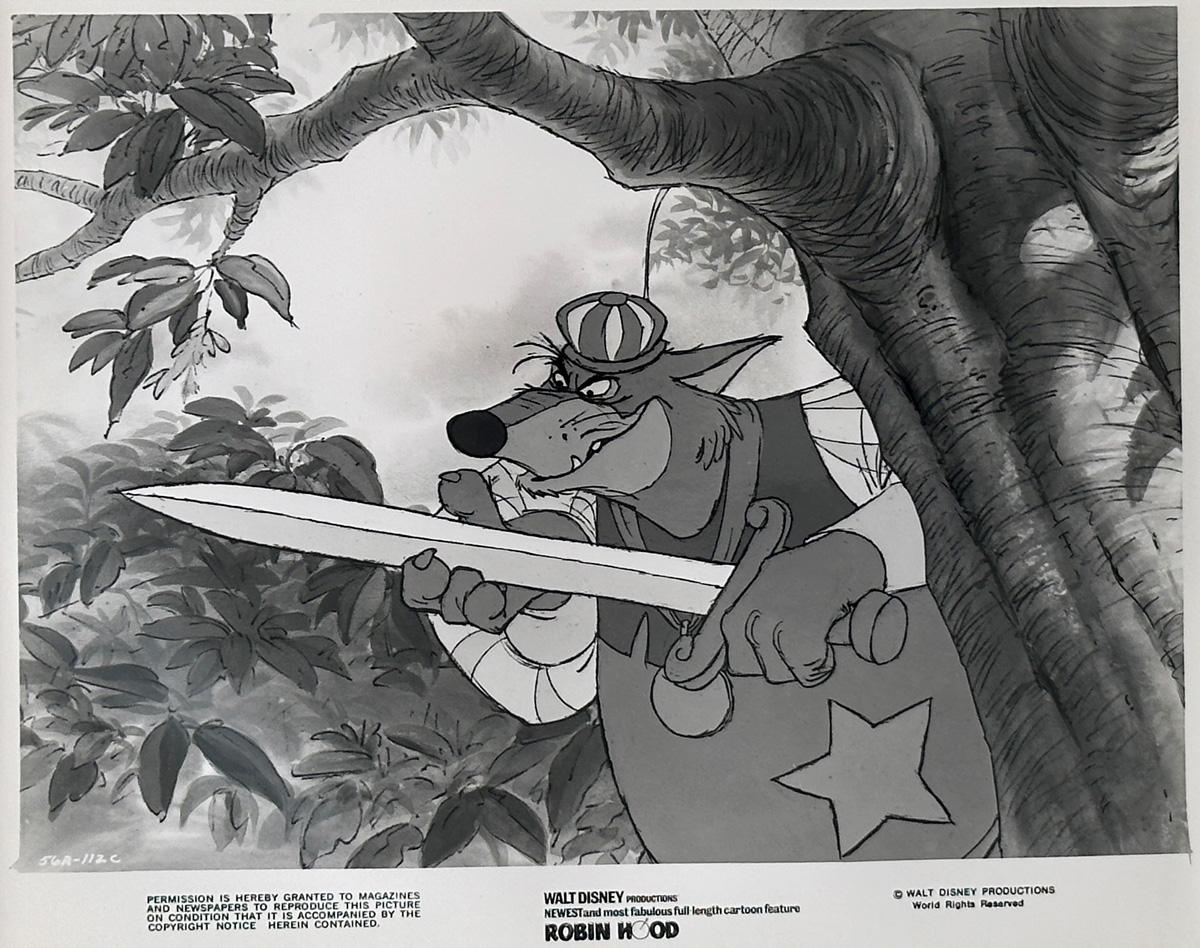 Foto pubblicitaria originale Disney 8x10 pollici per Robin Hood (1973) con una grande immagine dello Sceriffo di Nottingham.

Le foto pubblicitarie (film/produzione) sono state create per aiutare gli studios a promuovere i loro nuovi film. Le foto