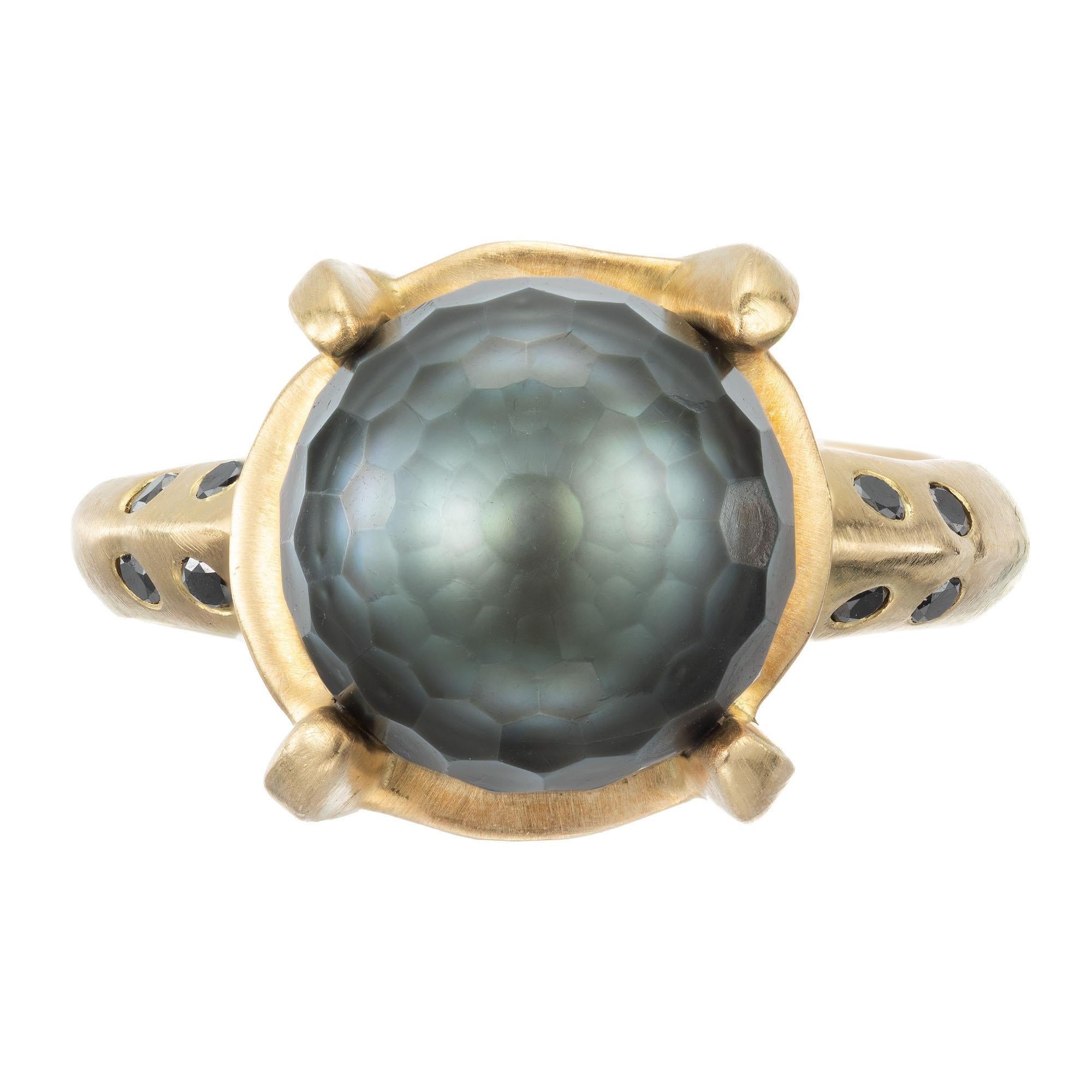 Robin Rotenier solid 18k yellow gold ring with brush finish, set with black diamonds and a center faceted black Tahitian cultured pearl.

1 black Tahitian faceted pearl 
12 round black diamonds, approx. .20cts
Size 8.5 and sizable 
18k yellow gold