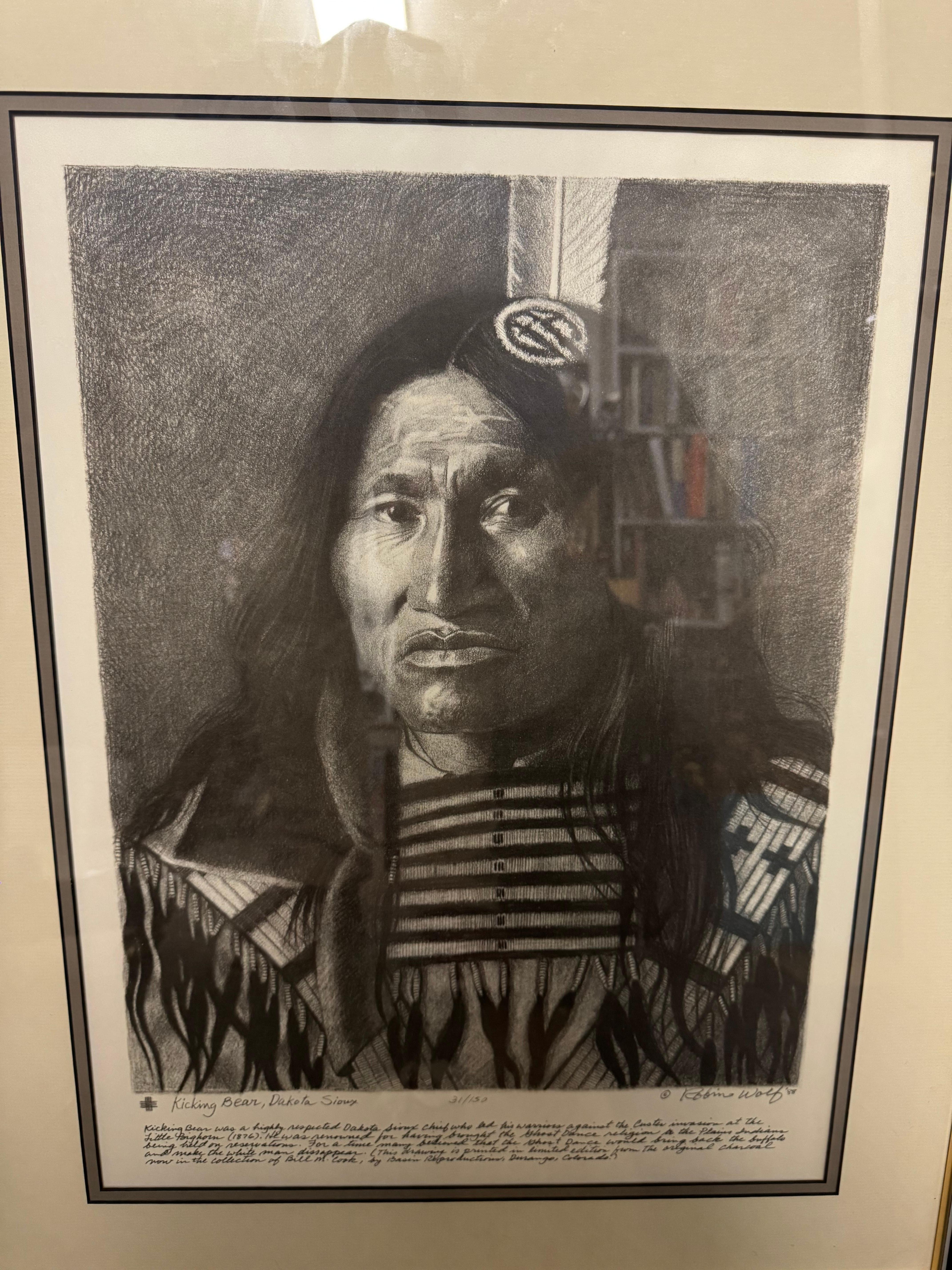 This lithograph is by Robin Wolf, an artist known for his finely detailed 
portraits of American Indians. This portrait is of Kicking Bear, a Dakota
Sioux Indian. It was rendered in 1988 and number 31/150.

Frame size is 27