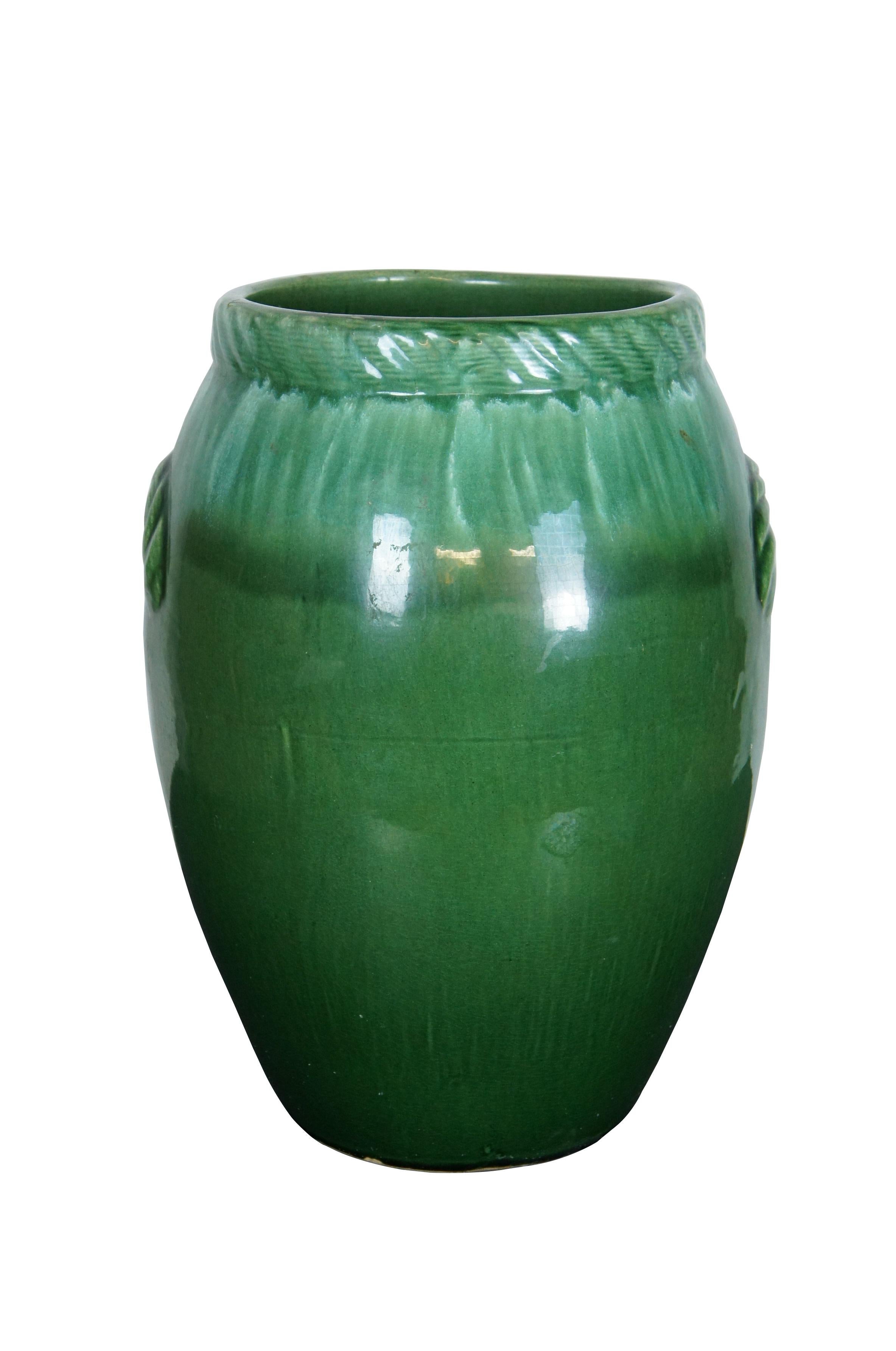 Large mid 20th century ceramic oil jar / floor vase - glazed in green and white, traditional ovoid shape with molded rope twist edge on mouth and faux rope handles on the sides. Marked USA on base. Attributed to Robinson Ransbottom Pottery.

