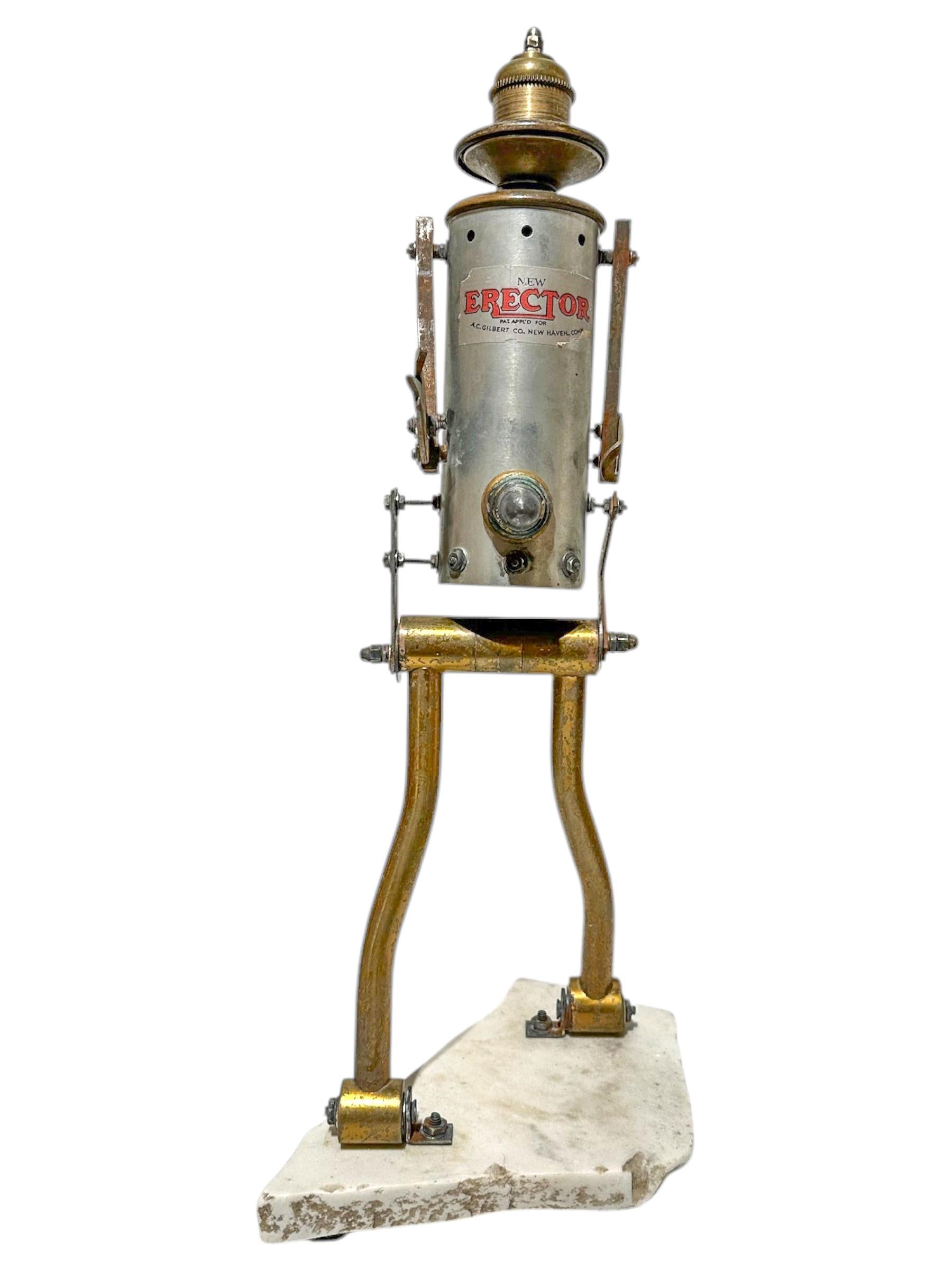 Self-taught artist John Seubert, AKA John Dolly, uses objects he uncovers as he rehabs older homes in Chicago. This piece is made from found and salvaged objects, including a child's Erector Set toy.  The artist has signed his name simply 
