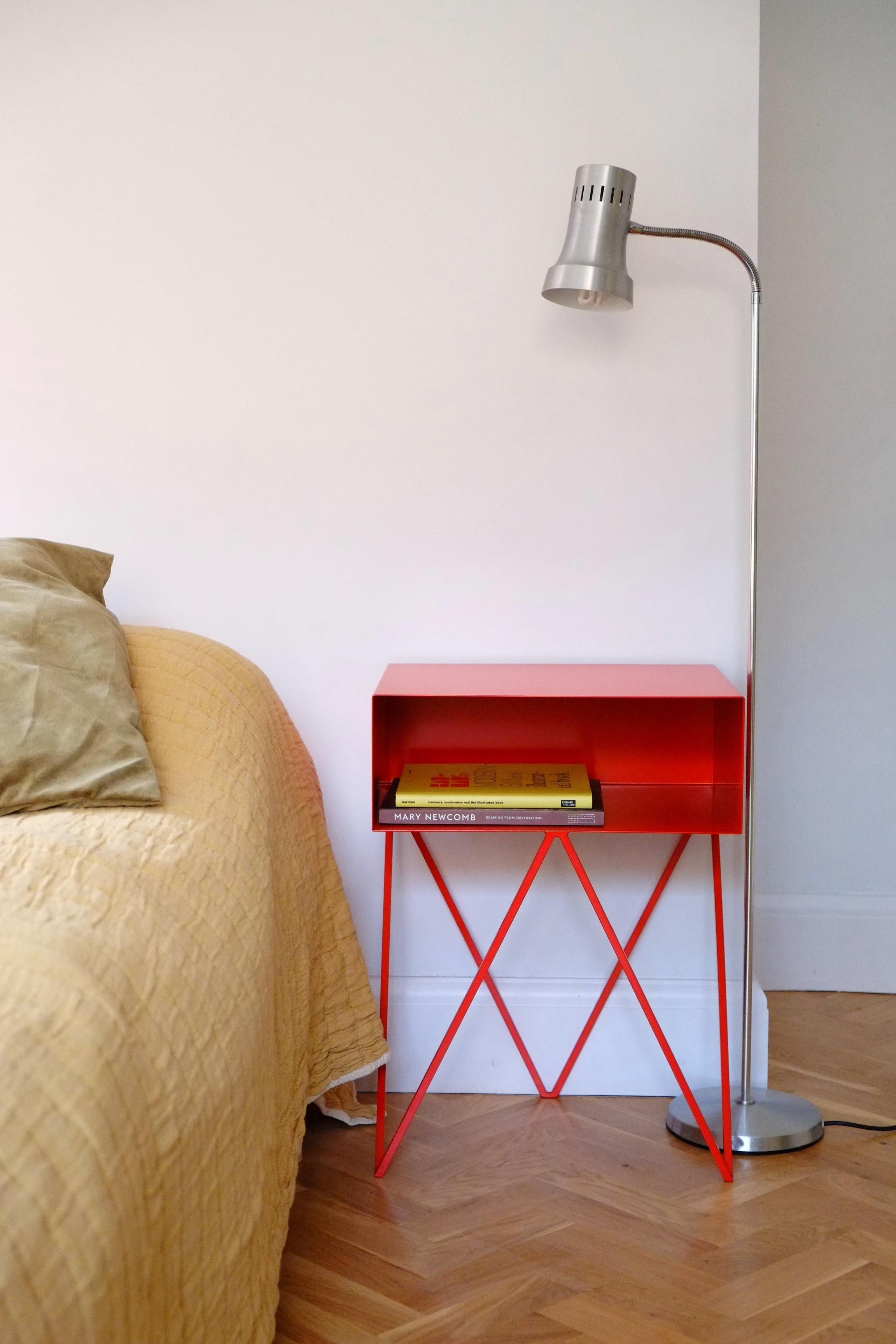 Our all-time best-seller the Robot side table features an open shelf on zig zag legs. A fun and functional design made of solid steel, powder-coated in gorgeous red. The clean lines look great against period details as well as in modern spaces.