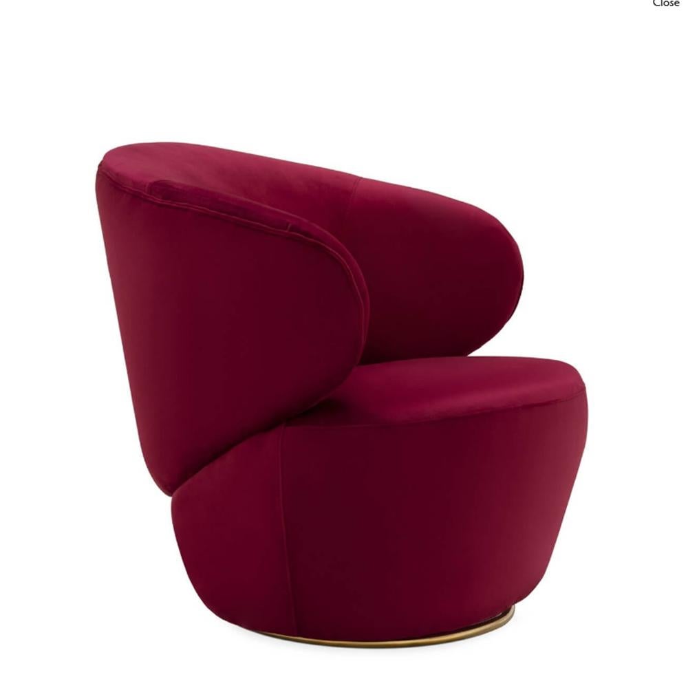 Armchair Robs with solid wood structure, upholstered and covered
with velvet fabric in deep red color. Swivel Armchair on solid polished 
brass base.