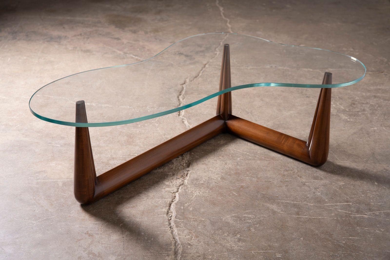T.H. Robsjohn-Gibbings Biomorphic Cocktail Table with a Fascinating Noguchi Connection

Designed by T.H. Robsjohn-Gibbings for Widdicomb, this stunning biomorphic cocktail table is a masterpiece of mid-century modern design. The sculptural base is