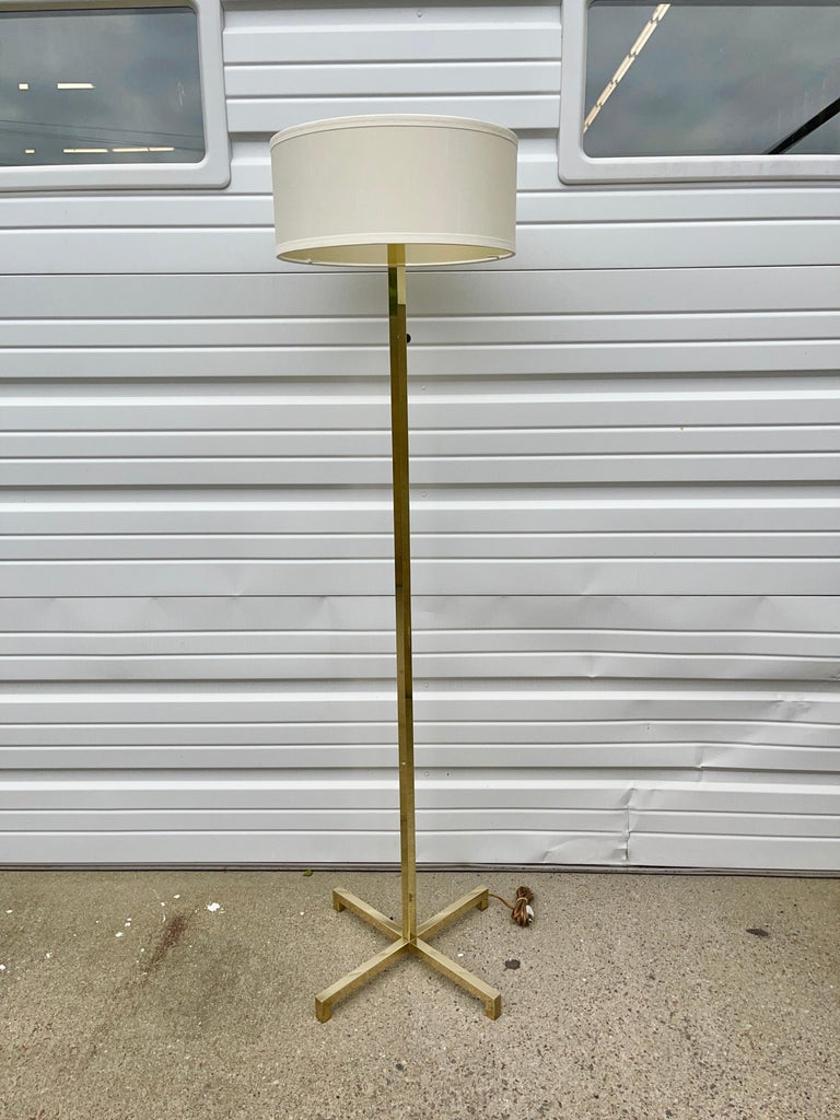 Iconic floor lamp designed by T. H. Robsjohn-Gibbings for Hansen Lighting of New York and produced by Metalarte, Barcelona. Solid brass square-bar cruciform base and stem. Switch on stem. Three UL ceramic E27 Edison sockets by Leviton mounted to